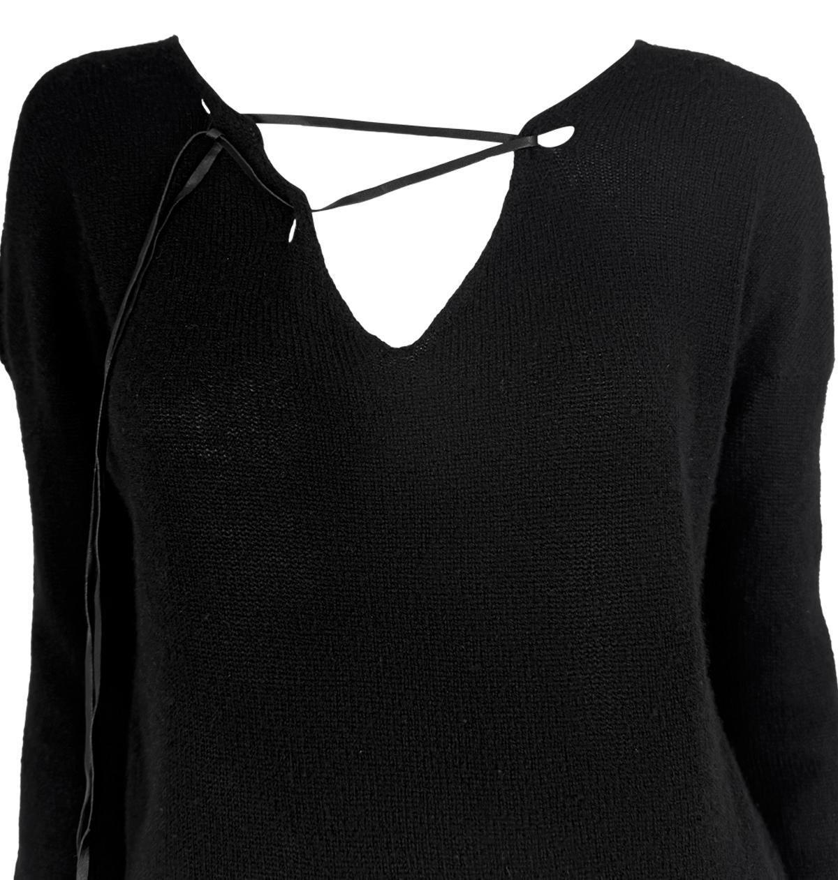 This black knit Gucci sweater by Tom Ford features a V-neckline with leather lace-up detailing and elongated sleeves. Designed in the late 1990s, it embodies Ford’s sleek, minimalist aesthetic.

Approximate measurements:
Size - M
Shoulder to hem: