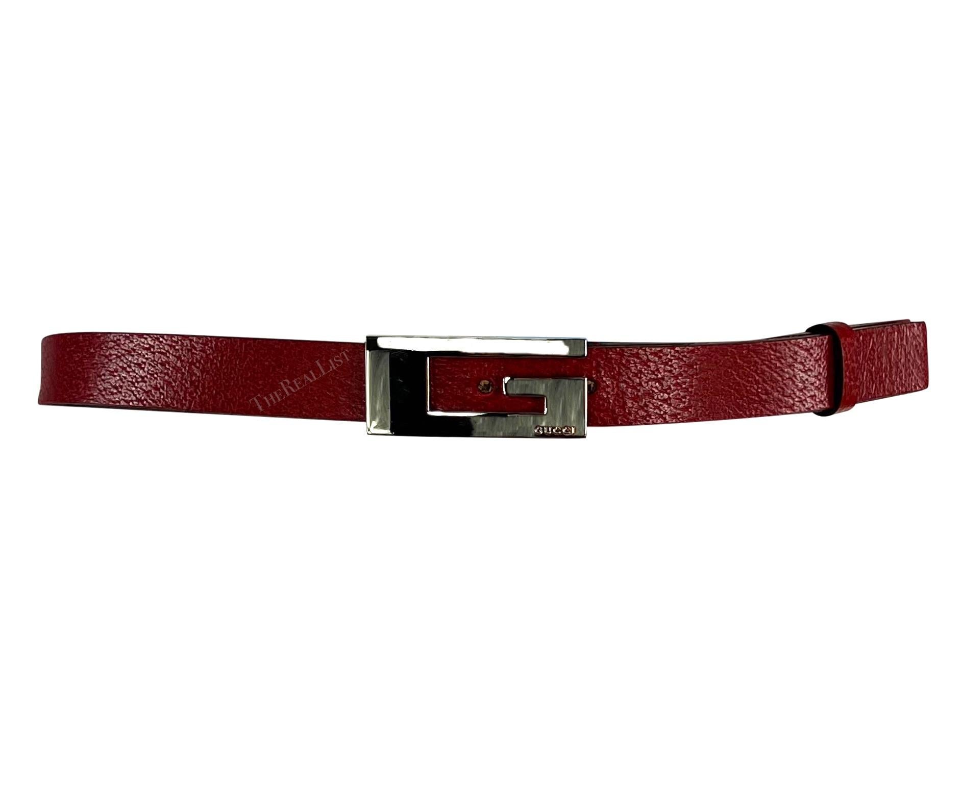 From the late 1990s, this thin leather Gucci belt was designed by Tom Ford. It features a slender design in red leather, accentuated by a distinctive square silver metal 'G' buckle at the front. 

Approximate measurements: 
Size - not listed
Width: 
