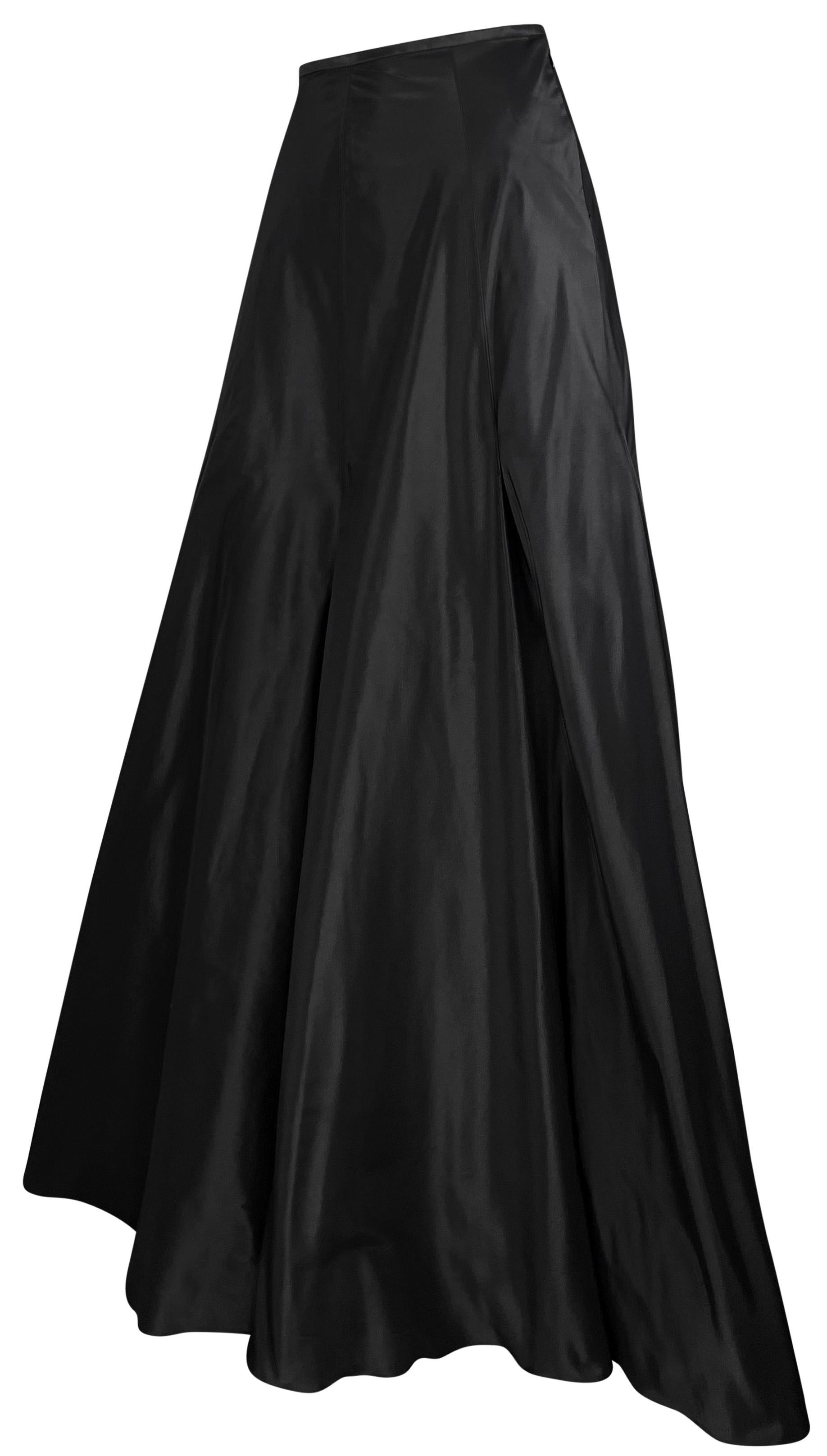 From the late 1990s, this black Ralph Lauren Purple Label evening skirt is a classically beautiful addition to any wardrobe. This high-waisted skirt is constructed entirely of silk taffeta and features an A-line cut. Perfect for your next black tie