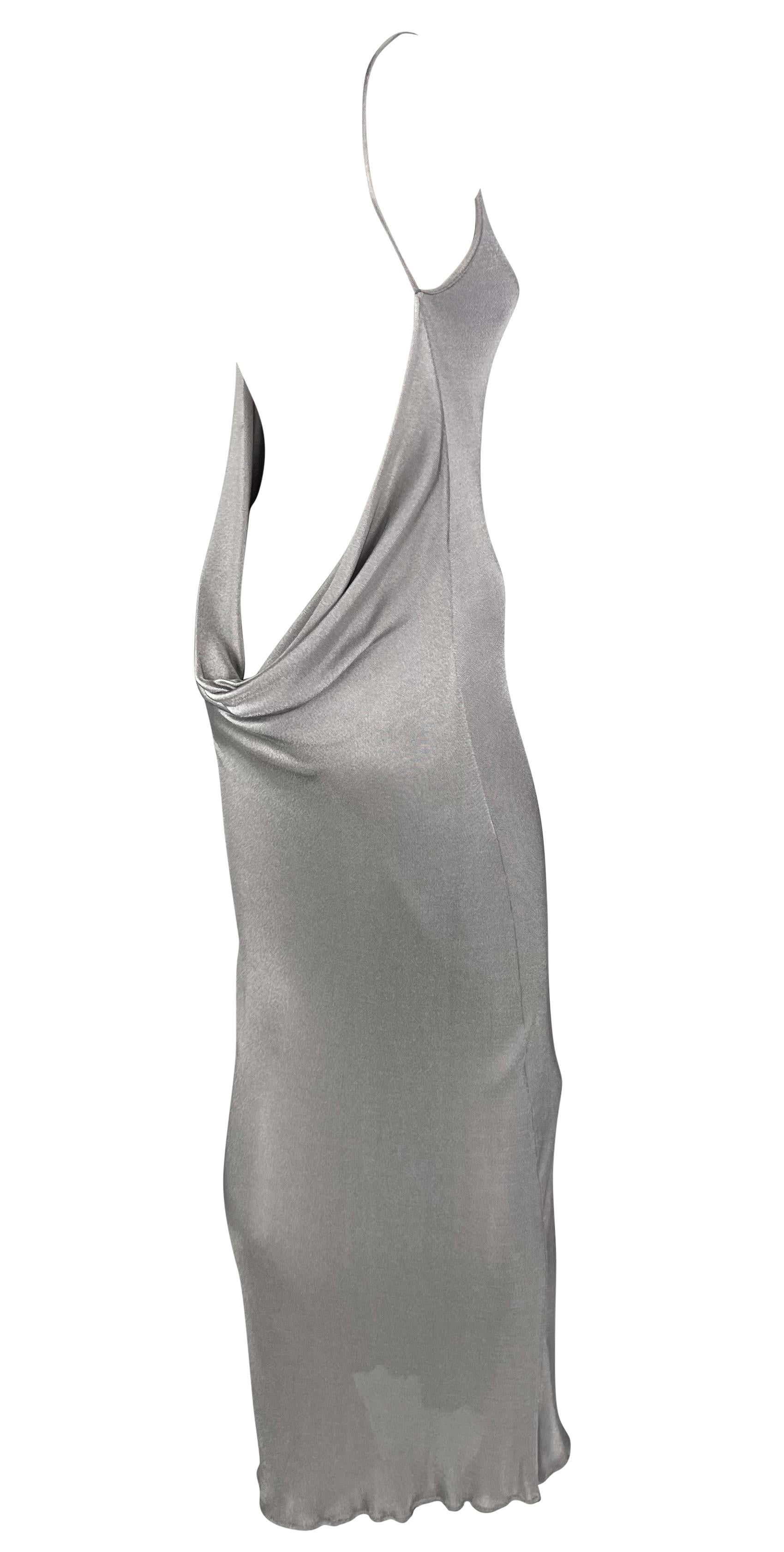 This backless silver gown by Yigal Azrouël, dating back to the late 1990s, epitomizes versatility. This chic gown fits the bill, whether for a formal occasion or a more casual event. It boasts a high, wide neckline and a captivating exposed back