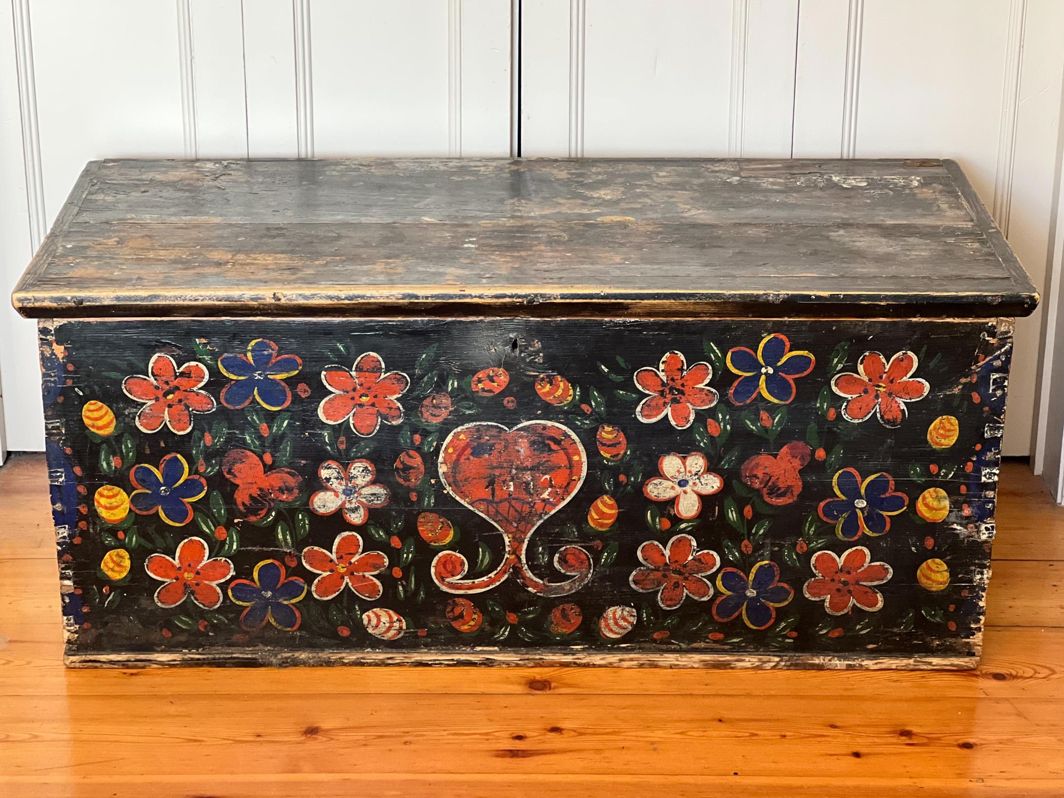 A late 19 C chest from Brittany, France. The floral folk art paintwork on the front and sides will have been done more recently towards the late 1900s to revamp the original artwork. A very decorative piece, beautifully painted with its original