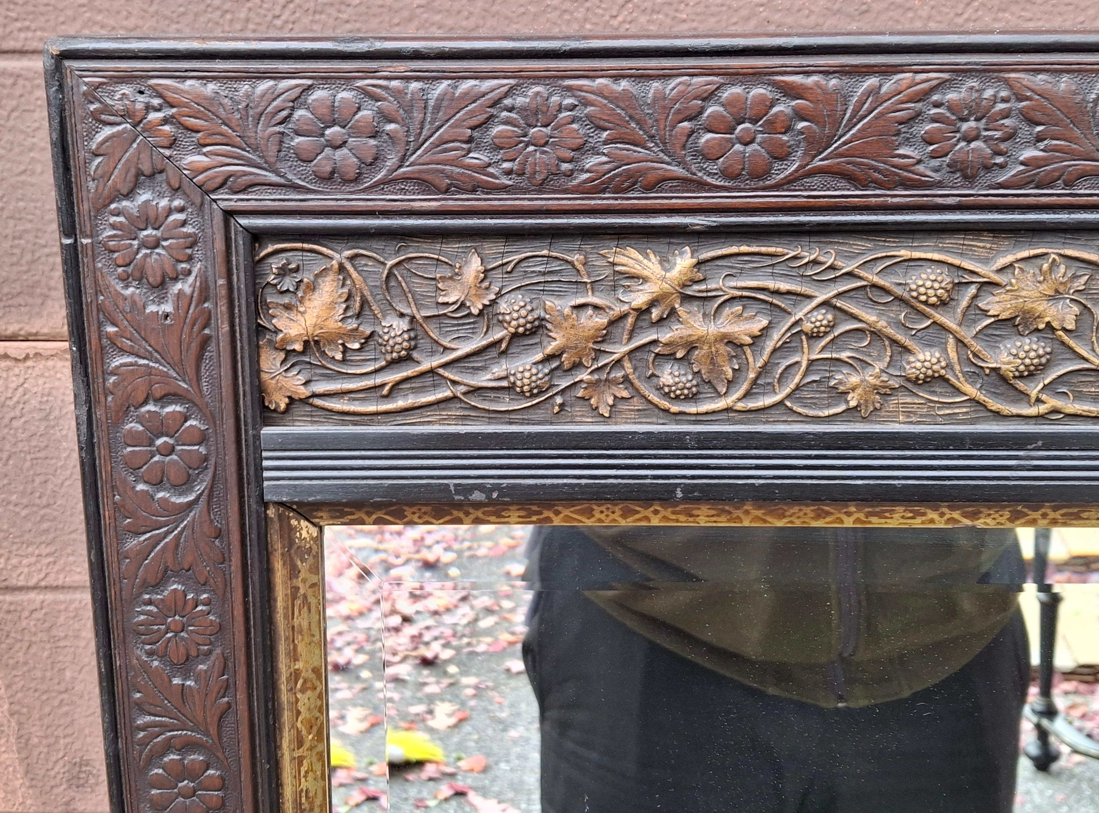Ebonized Late 19th C. Aesthetic Movement Carved Mahogany and Parcel Gilt Frame Mirror For Sale