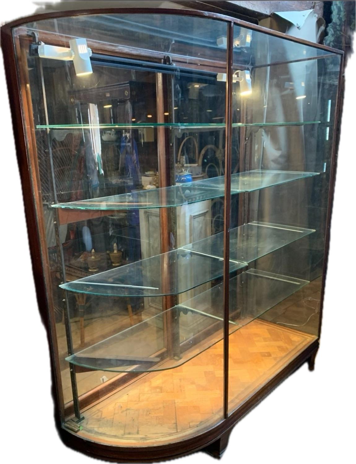 Hand-Crafted Late 19th C. Bow Glass Sided Display Cabinet from an Upscale Boston Fashion Shop For Sale