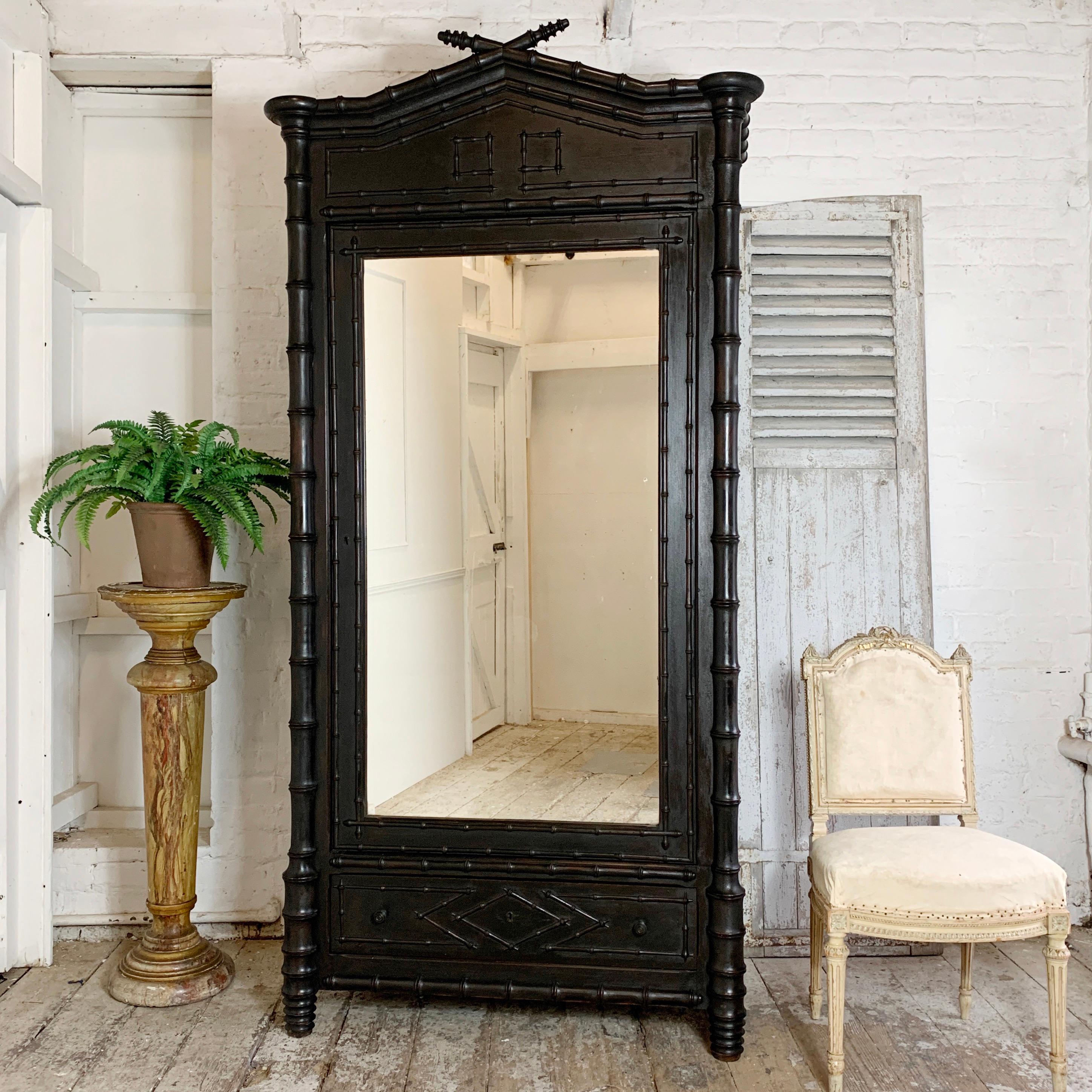 Faux Bamboo Colonial Style Armoire
Dark Black Brown In Colour
Original Paint
French, Late 19th Century
Carved Wooden Bamboo Effect Design
Large Mirrored Door
Drawer To The Bottom And Hanging Hooks Inside
226Cm Height, 112Cm Width, 58Cm