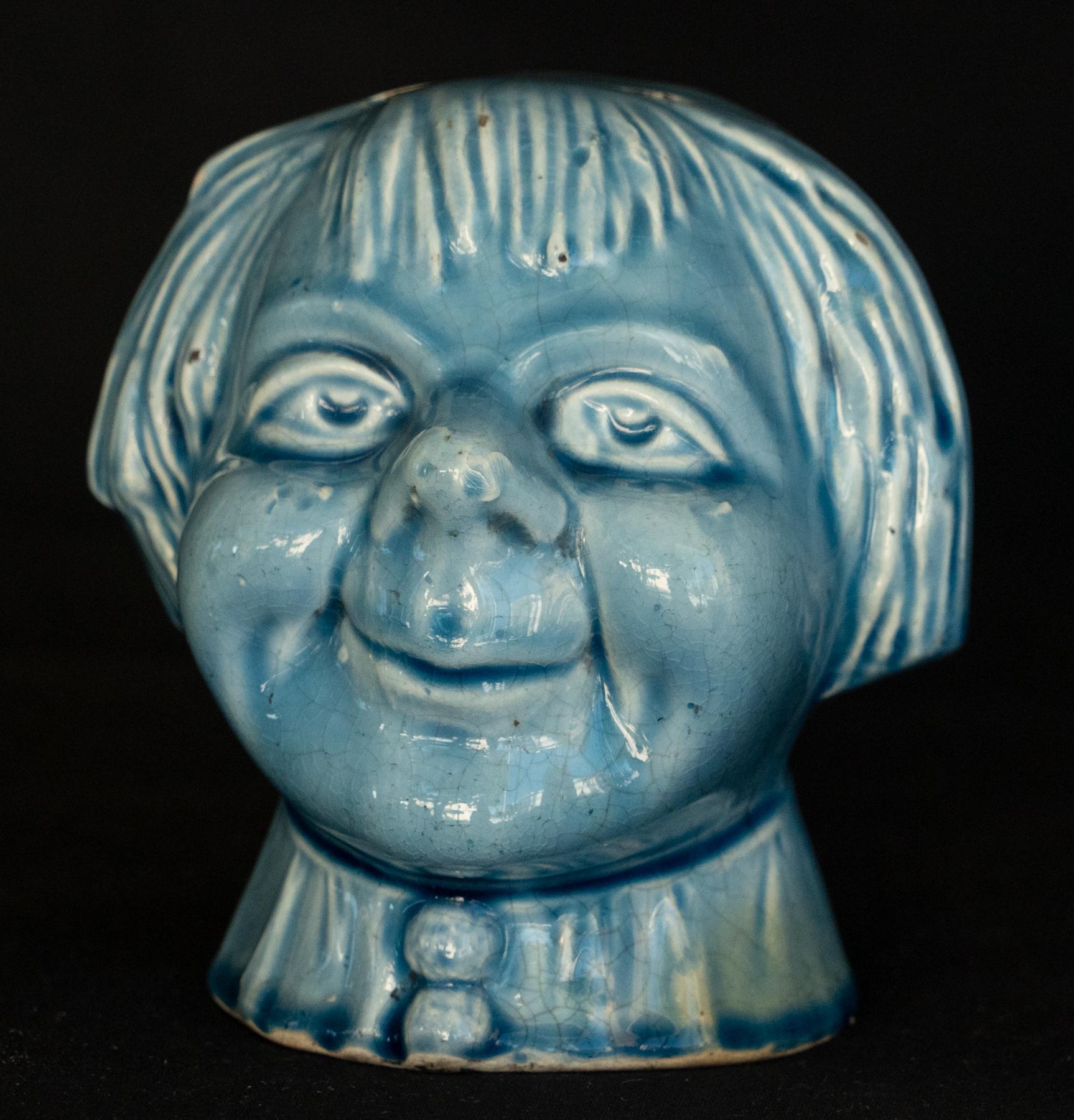 Late 19th century French Majolica Bank Of A Pixie Boy. 
From the Walter P. Chrysler Jr. Collection Label No.
Sold by David Hollander NYC. striking blue glaze with fine crackling in places.