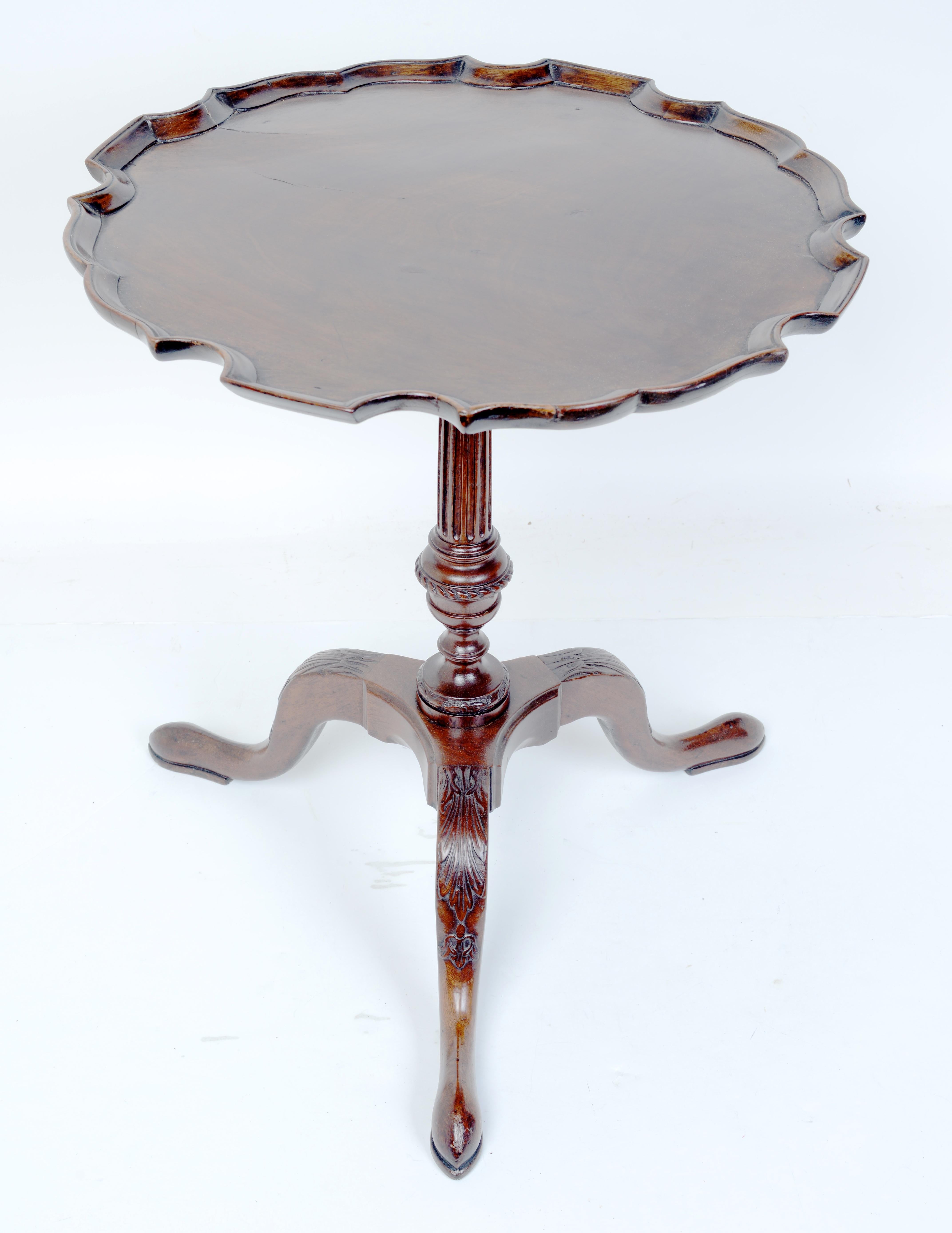 Late 18th c Geo III Mahogany Pie Crust Side Table. This Pie Crust Table has a newer circular top with the iconic pie crust rim indicative of expert woodworking, married to a period base. The top is supported by a fluted and finely carved support