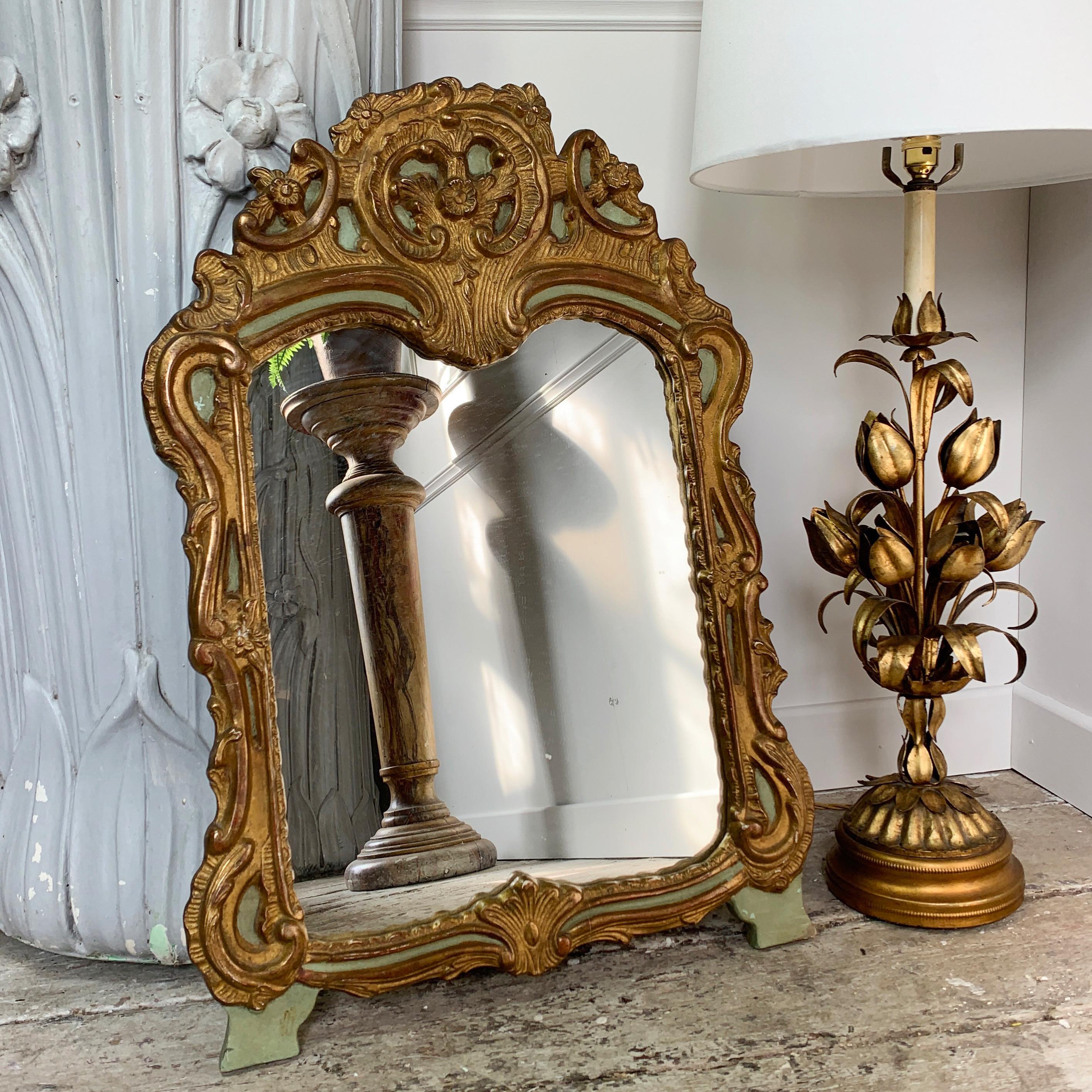 Beautiful late 19th century mirror.
Deep carved frame, heavy wood, possibly walnut, with gold and duck egg green finish.
Probably Italian, with later glass.
The back bears the remains of old French newspaper, so it has travelled north in the last