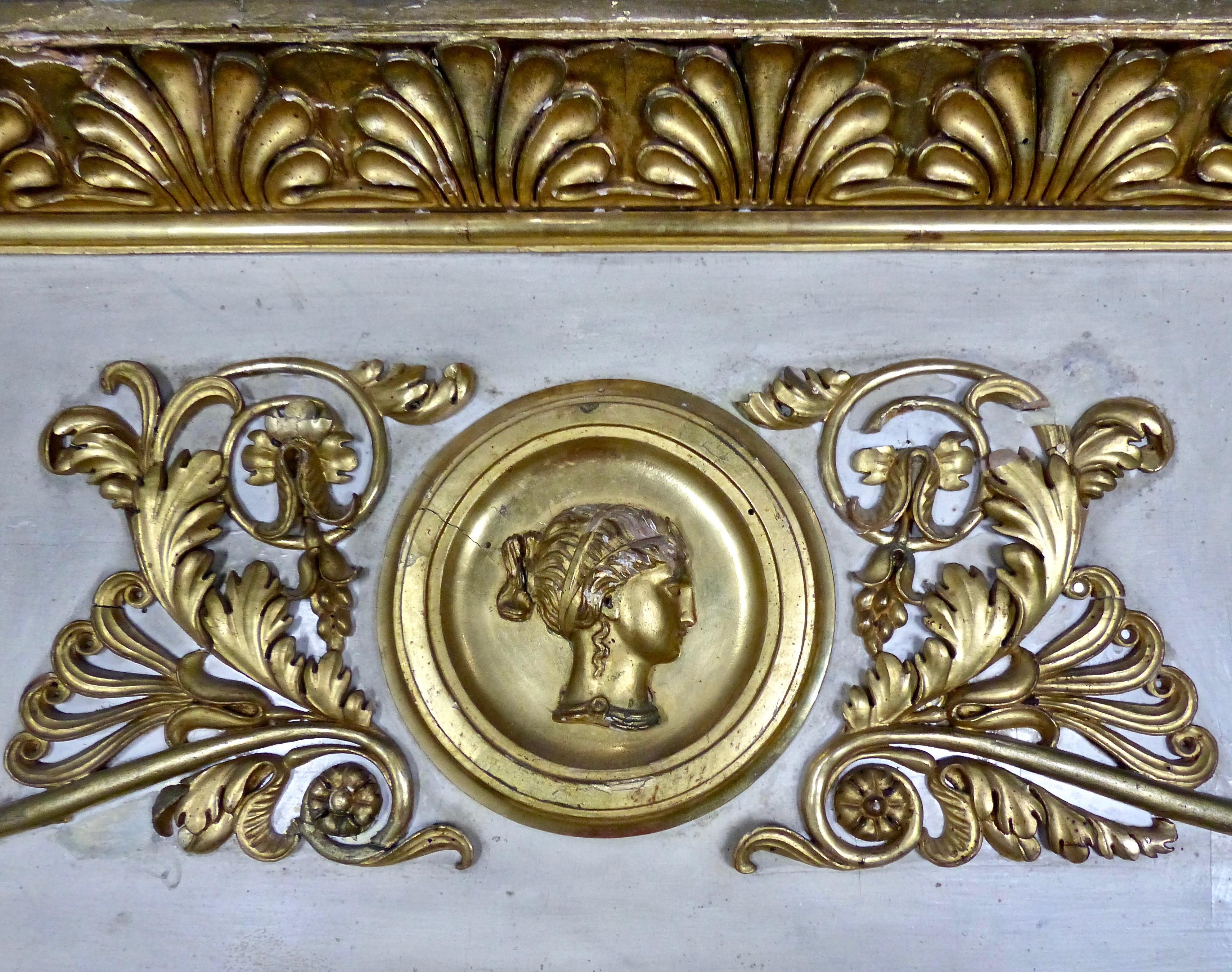 A large and spectacular giltwood Italian trumeau mirror from circa 1880. Cameo-style cartouches as well as other decorative details in beautifully crafted gold leaf. A Classic signature for your home.
Dimensions: 68 H” x 57 W” x 5 D”.