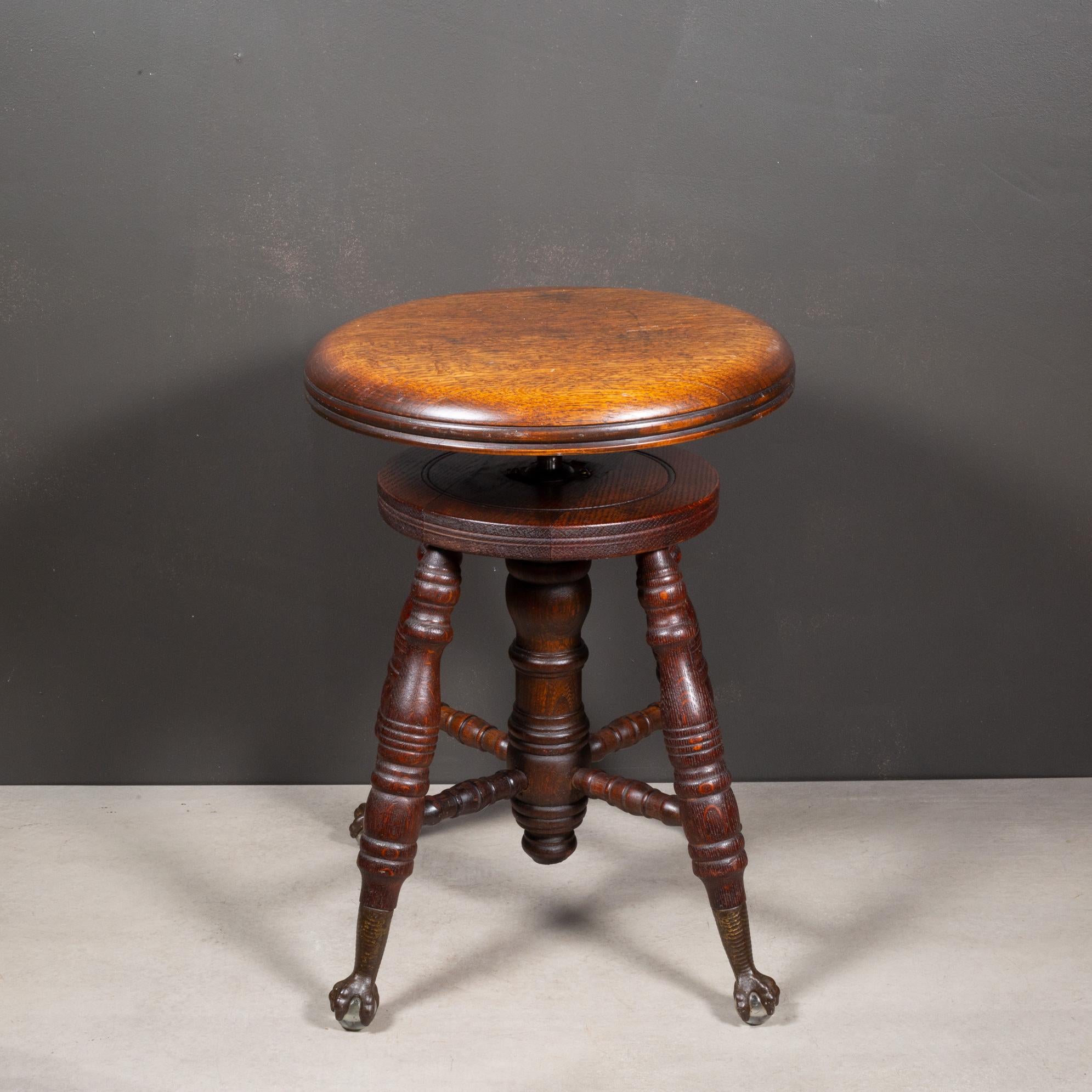 ABOUT

An antique Mahogany piano stool with adjustable seat over turner legs terminating in metal claw and glass ball feet.

    CREATOR The Charles Parker Co. 
    DATE OF MANUFACTURE c.1880-1900. 
    MATERIALS AND TECHNIQUES Mahogany, Cast Iron.