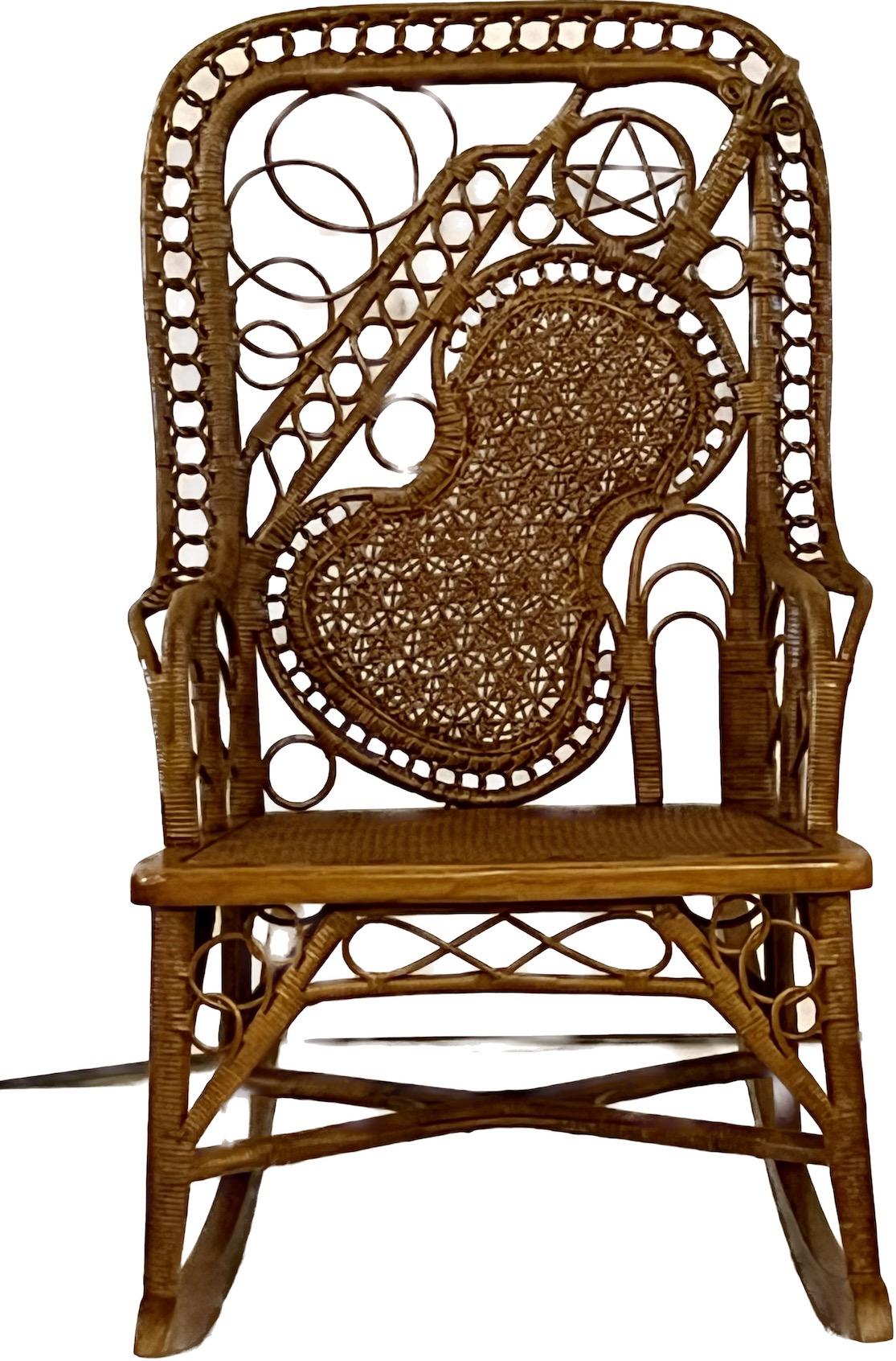 A very rare wicker rocker by the Wakefield Rattan Company, Wakefield Massachusetts, C. 1890s in wonderful condition. This rocker is part of a matching set which can be purchased separate or together.The set  consists of the Mothers rocker and