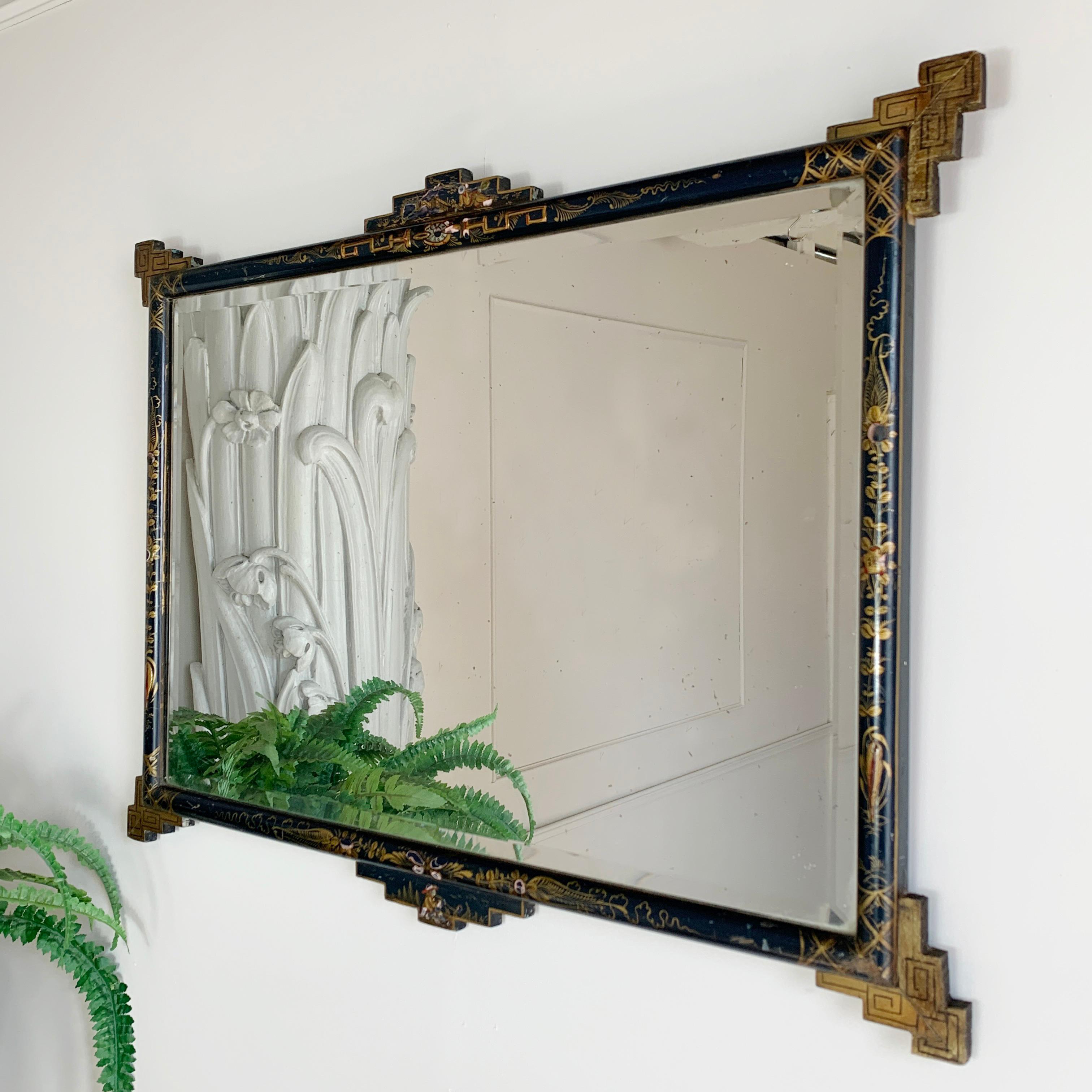 Late 19th century lacquered chinoiserie mirror in fabulous French navy blue colour
Dating from around 1890's
Navy background with gilt painted oriental landscapes and figures and unusual Greek key corner detailing
Original beveled mirror plate