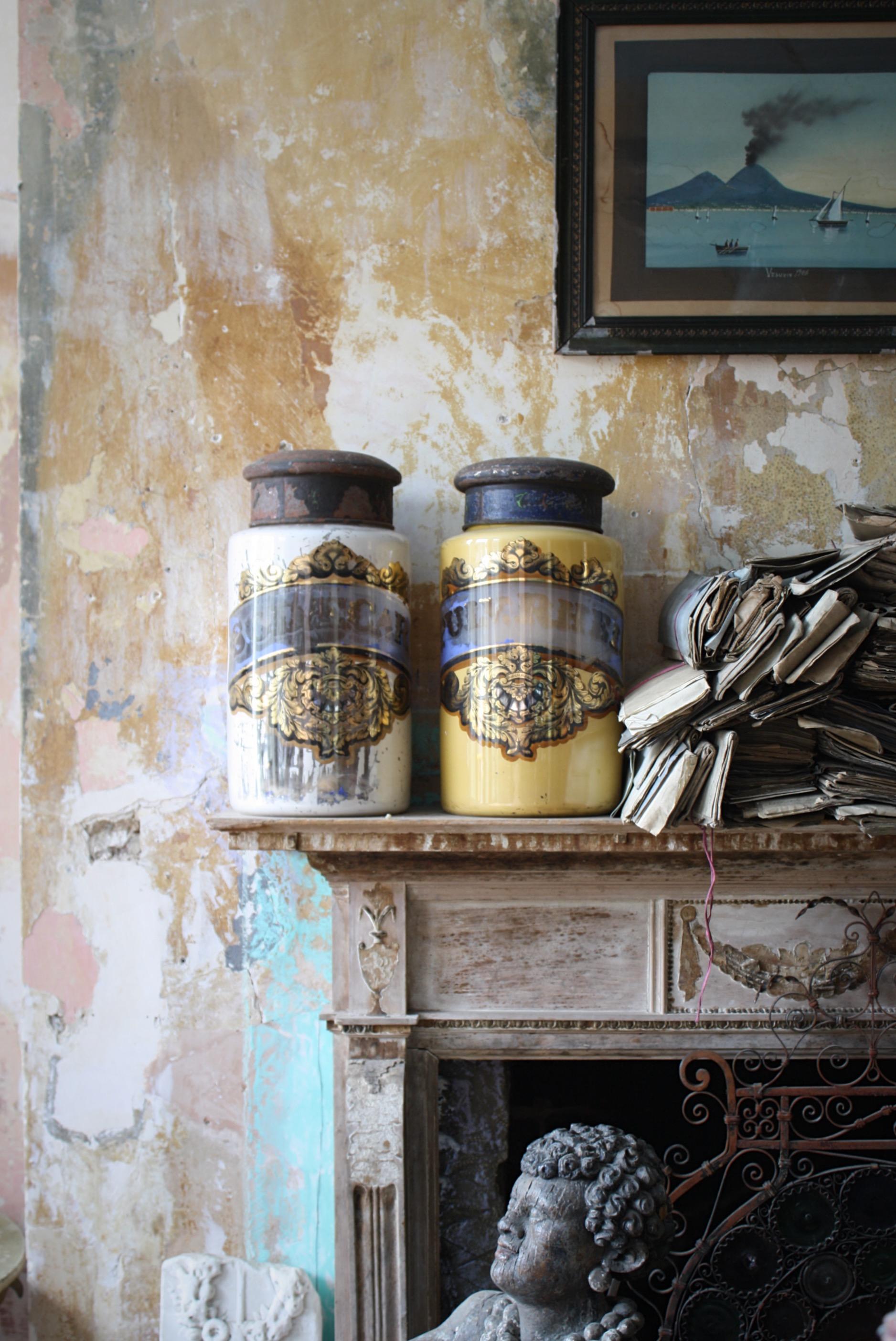 A highly decorative pair of reserve painted pharmacy dry storage jars. 

Both jars with painted steel lids, the jars with pontil marks to the base as one would expect for hand blown glass of the period. The internally painted bodies with losses