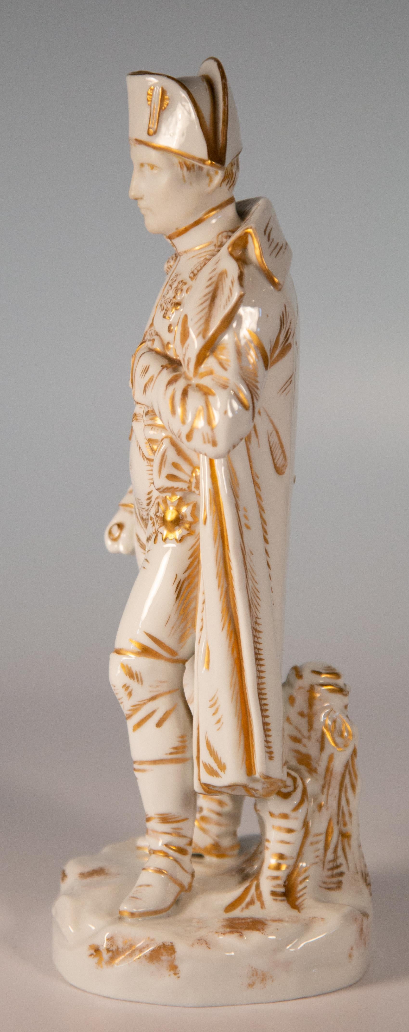 Late 19th century Paris porcelain standing statue of Napoleon Bonaparte, circa 1880.
White porcelain with gilt decoration. Contrasting bisque face with gazing eyes.
Classic pose with the left arm tucked into the shirt vest.