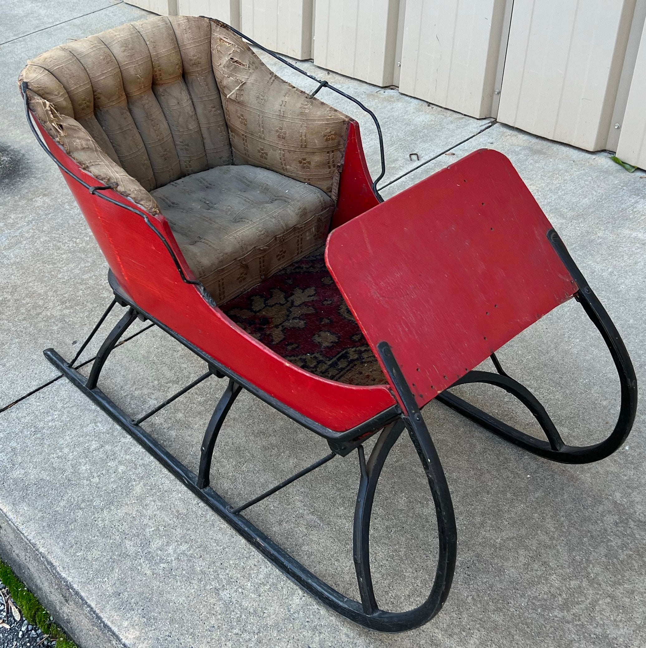 Every year I love to sell one of these! This is a Victorian Era child’s sleigh. It’s festive red is original paint! The footbed is lined with an antique carpet remnant. The channel back does show a bit of wear but oh what fun!