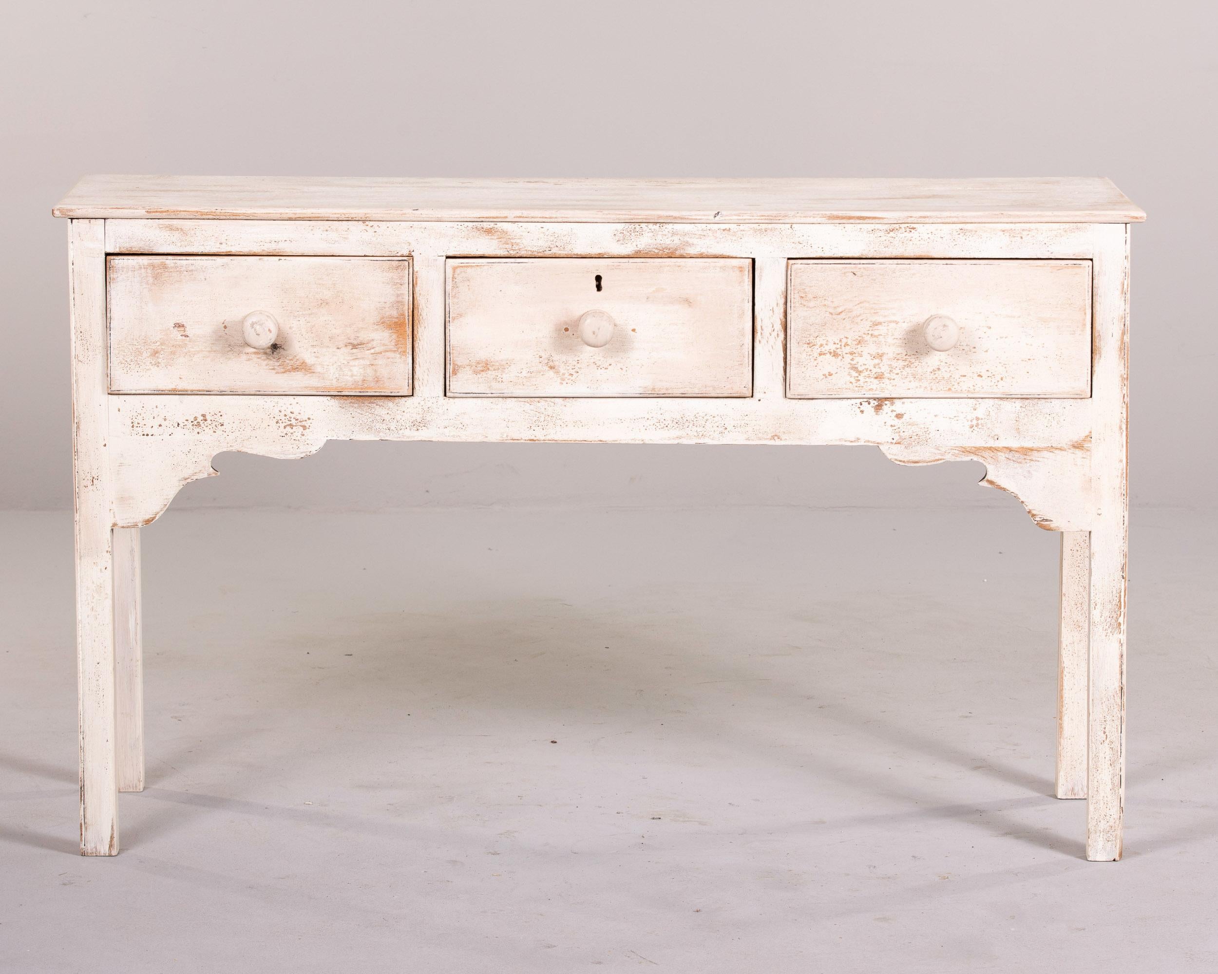 Found in England, this painted server dates from the 1880s. This server features three functional drawers with dovetail construction and wood knobs. There is an escutcheon on the middle drawer, but no key found with this piece. We believe the wood
