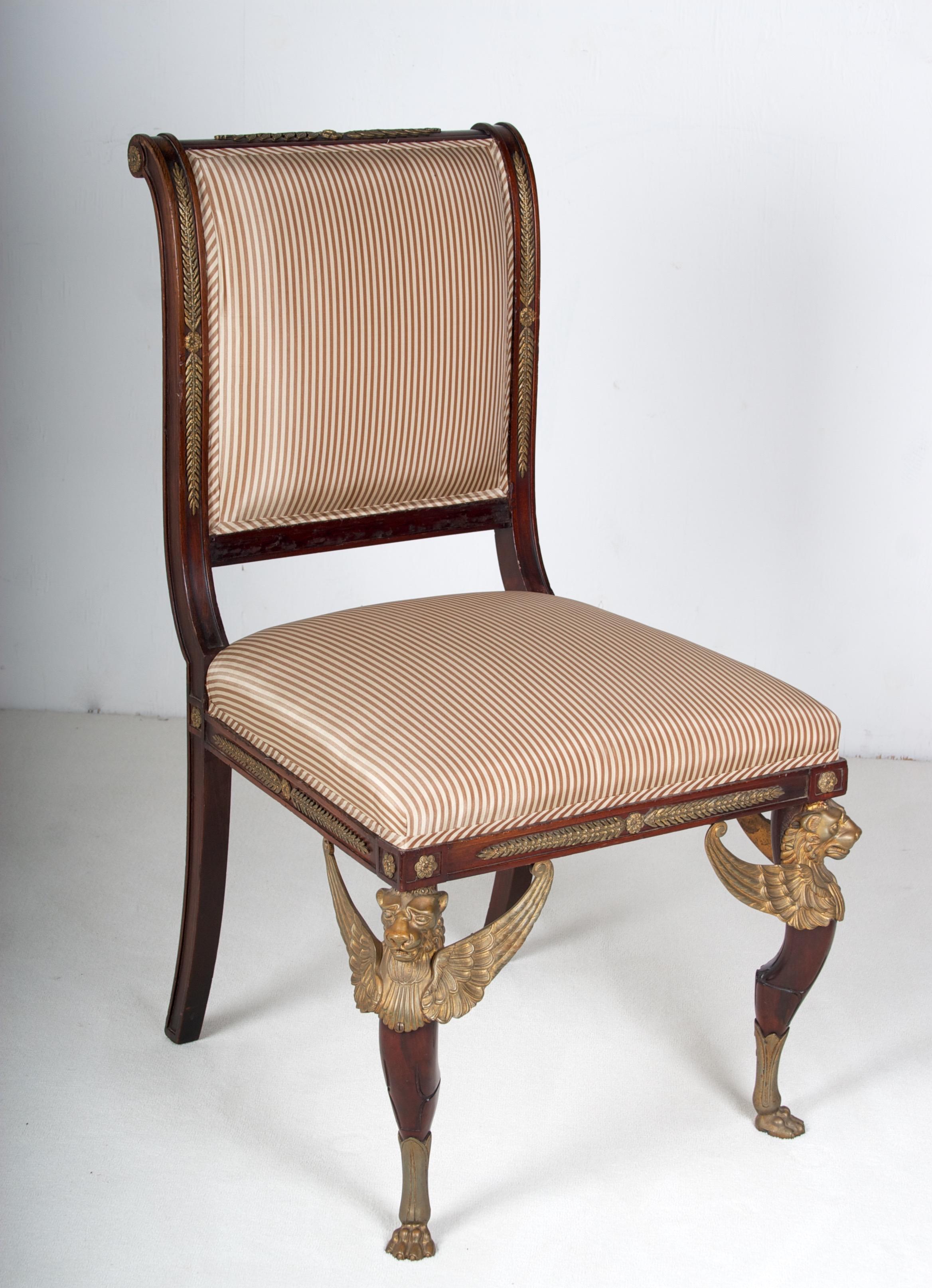 A excellent quality late 19th century mahogany side chair in the French empire style with superb
ormolu mounts probably by EH Kahn & Co. London.
Back, side rail, seat rails are all decorated with foliate and rosette ormolu mounts,
supported on