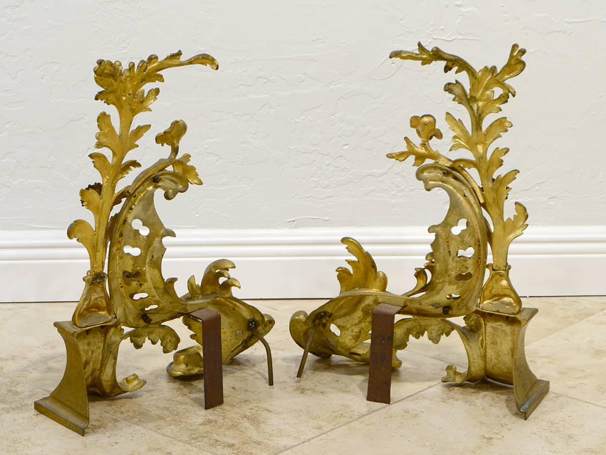 Modeled with architectural elements, scrolls, leaf work and flowers these chenets are in the typical rococo style and make a wonderful lively yet stately impression, late 19th century.