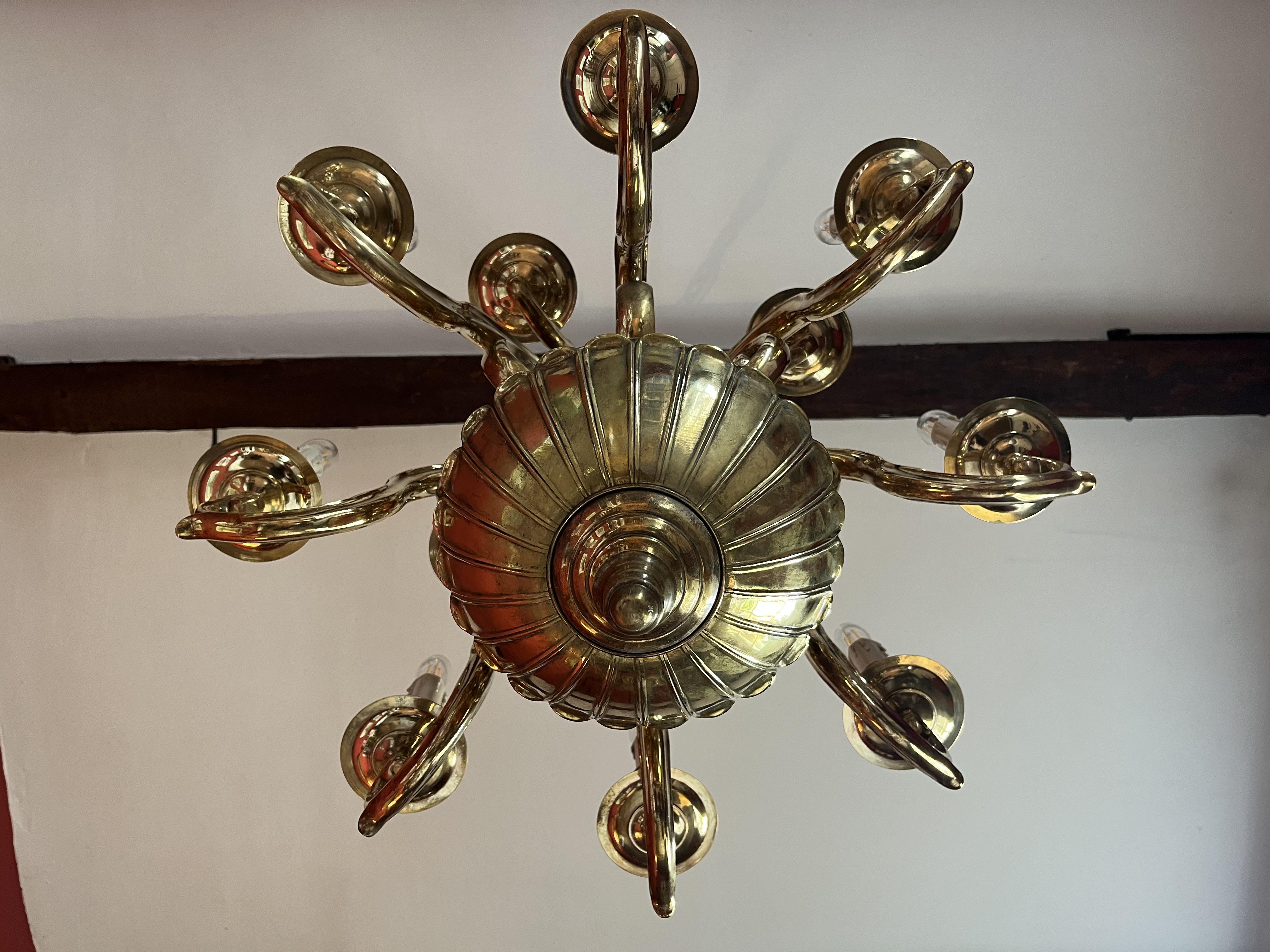 Cast Late 19th Century 12 light Solid Brass Flemish style chandelier  For Sale