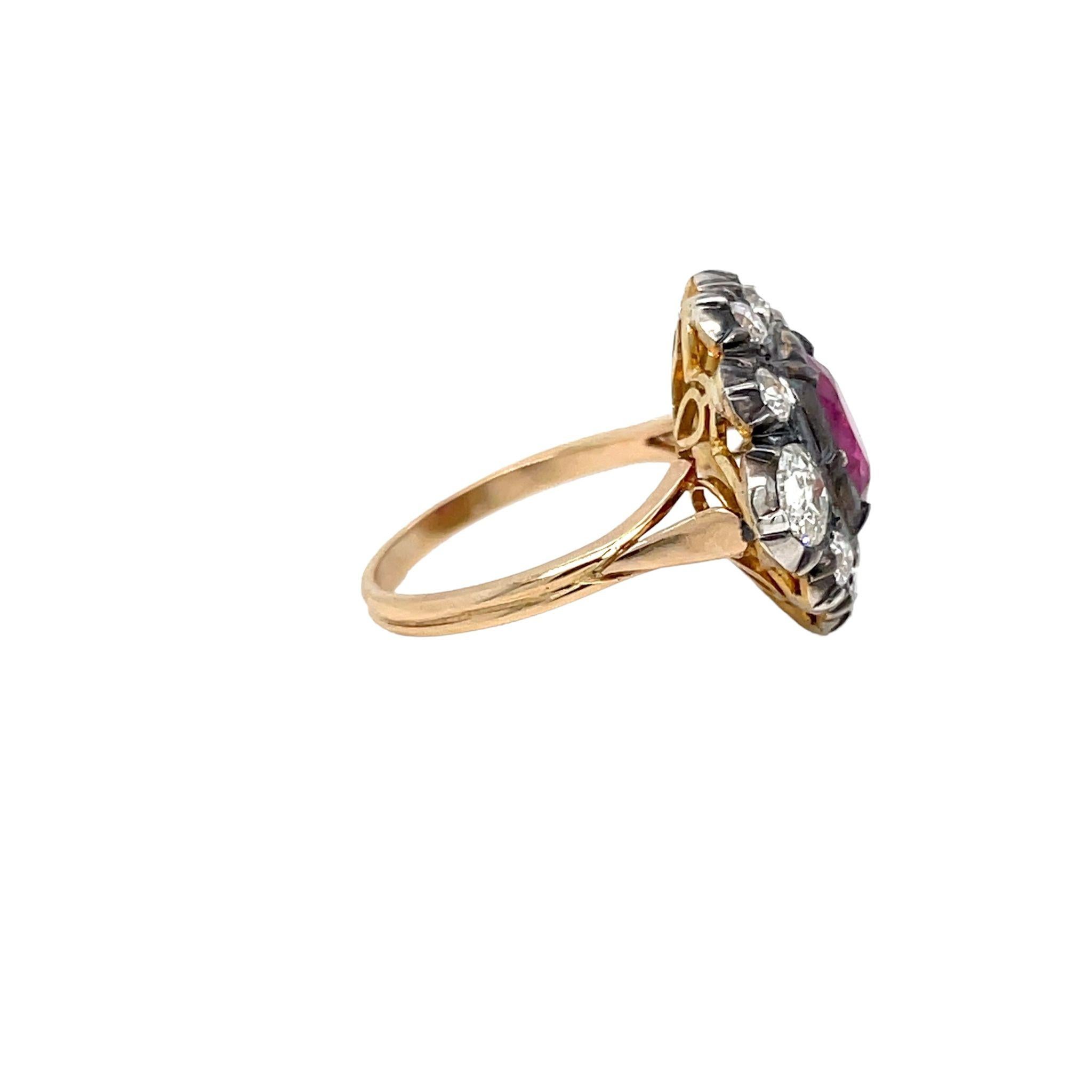 Antique 18Kt rose Gold and silver Ruby and Diamond ring.
The cluster style ring is centered with an approximately 2.05 carats stunning oval ruby, Thailand origin, accented by an halo of sparkling old mine cut diamonds weighing approx. 1.60 carats