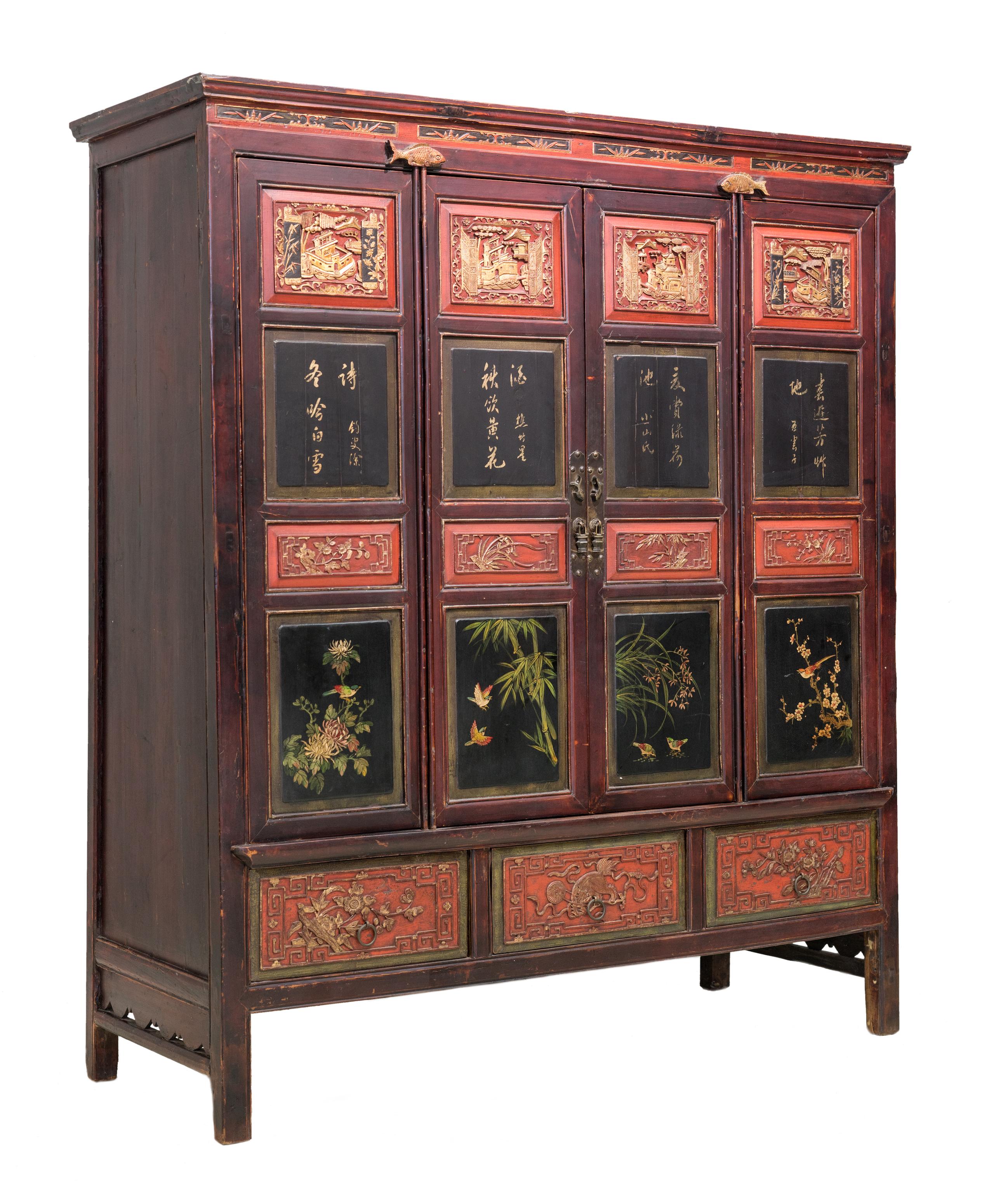 Late 19th century 4-door cabinet from Dong Yang, Zhejiang province, China. Very fine carvings on the four panels across the top and on the bottom three drawers. The slim middle carved panels have designs of different flowers representing the four