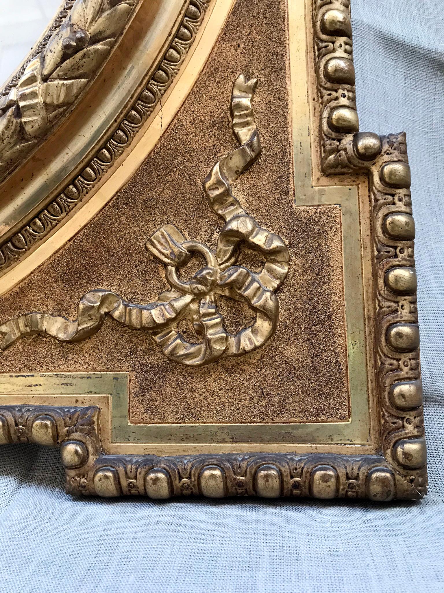 Carved Late 19th Century Alfonsino Mirror in Burnished Gold Leaf with Stucco Embossed For Sale