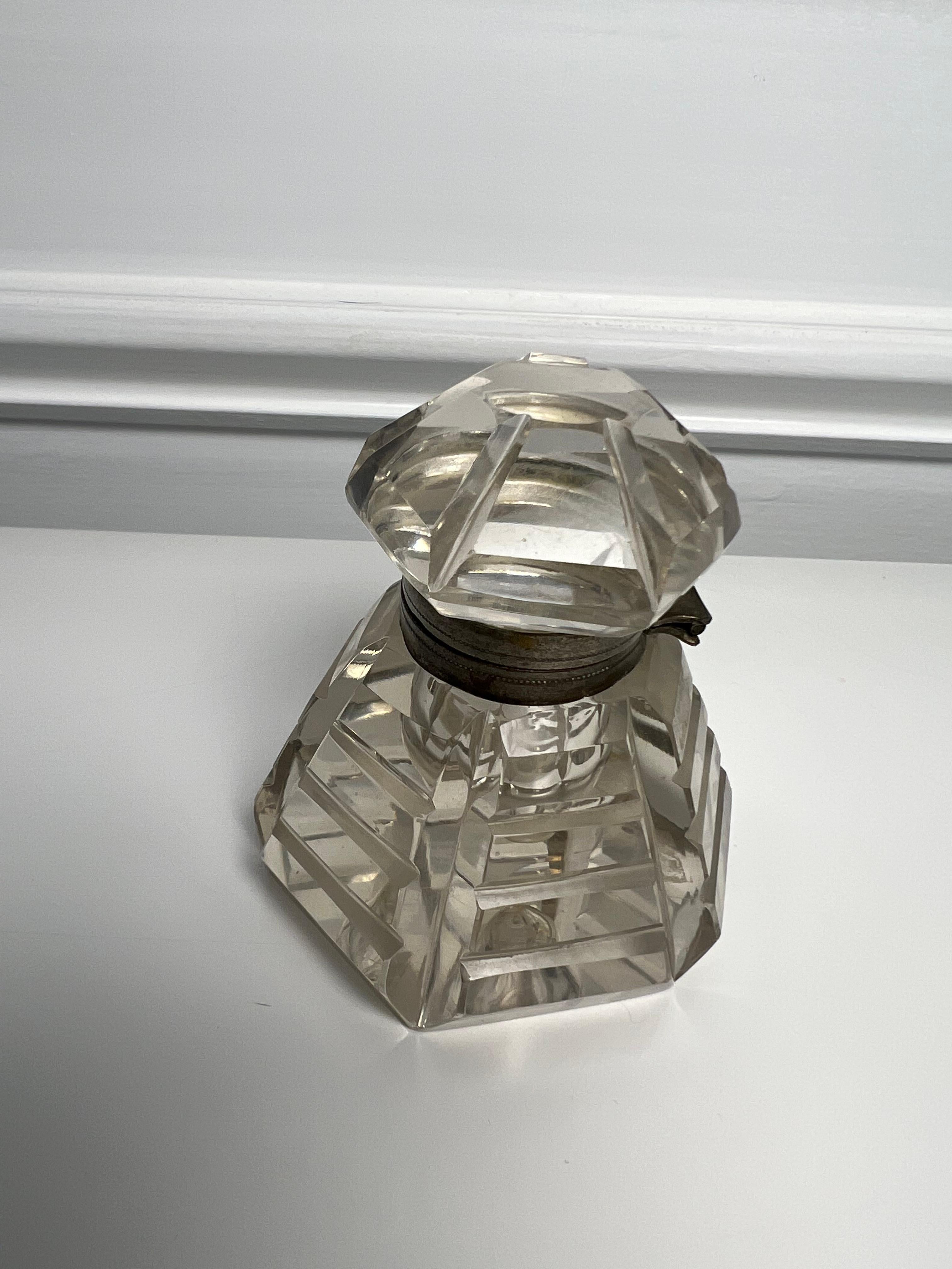 Late 19th century six sided crystal inkwell with deep mitre cuts in the sides and a hinged top. A nice piece for a collector or just sitting on a desk top. From a private collector who traveled the world buying unique pieces.