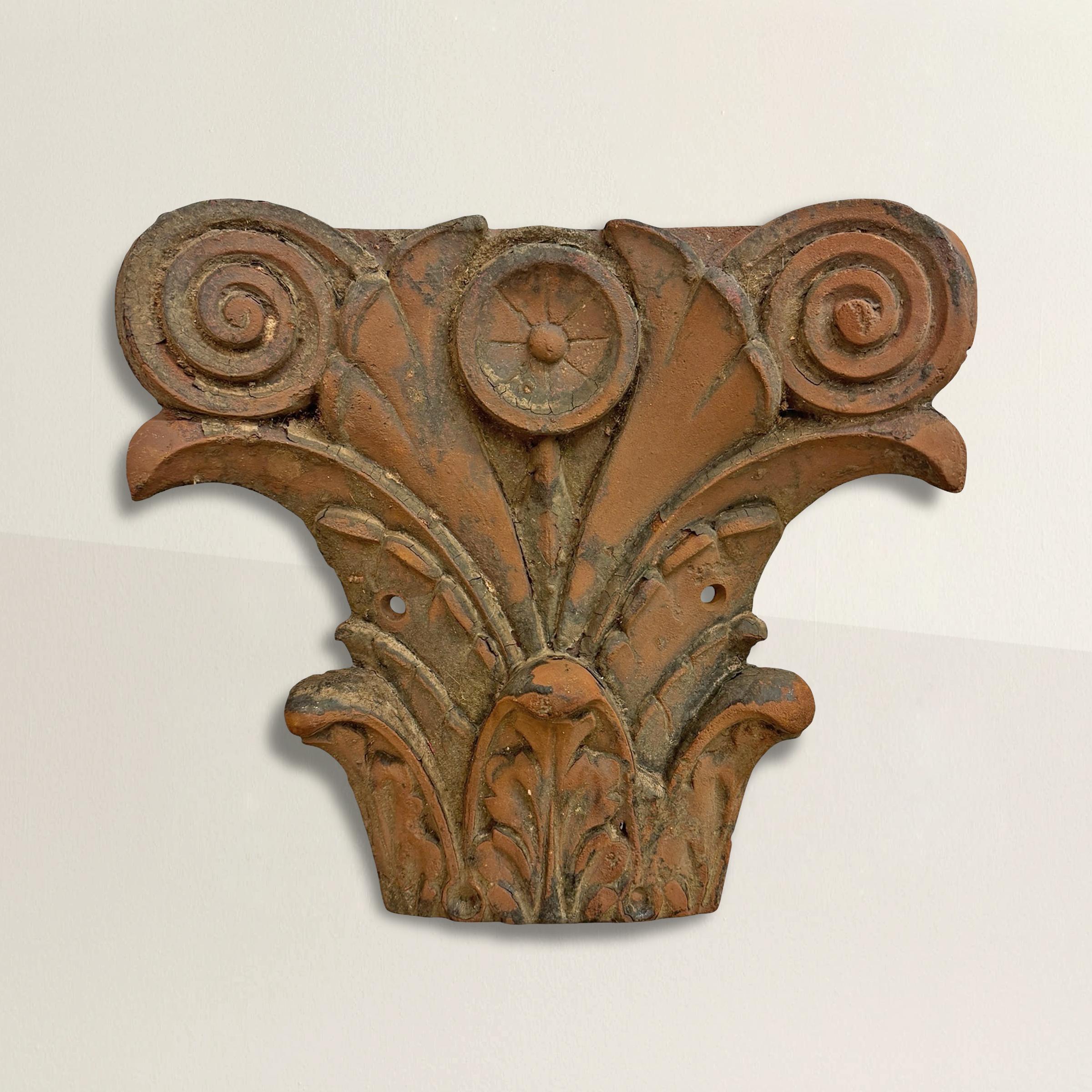 
This 19th-century American cast iron pilaster capital is a stunning example of early Art Nouveau design, blending classical architectural elements with a touch of organic flair. Crafted in the composite order, it features swirled volutes framing a