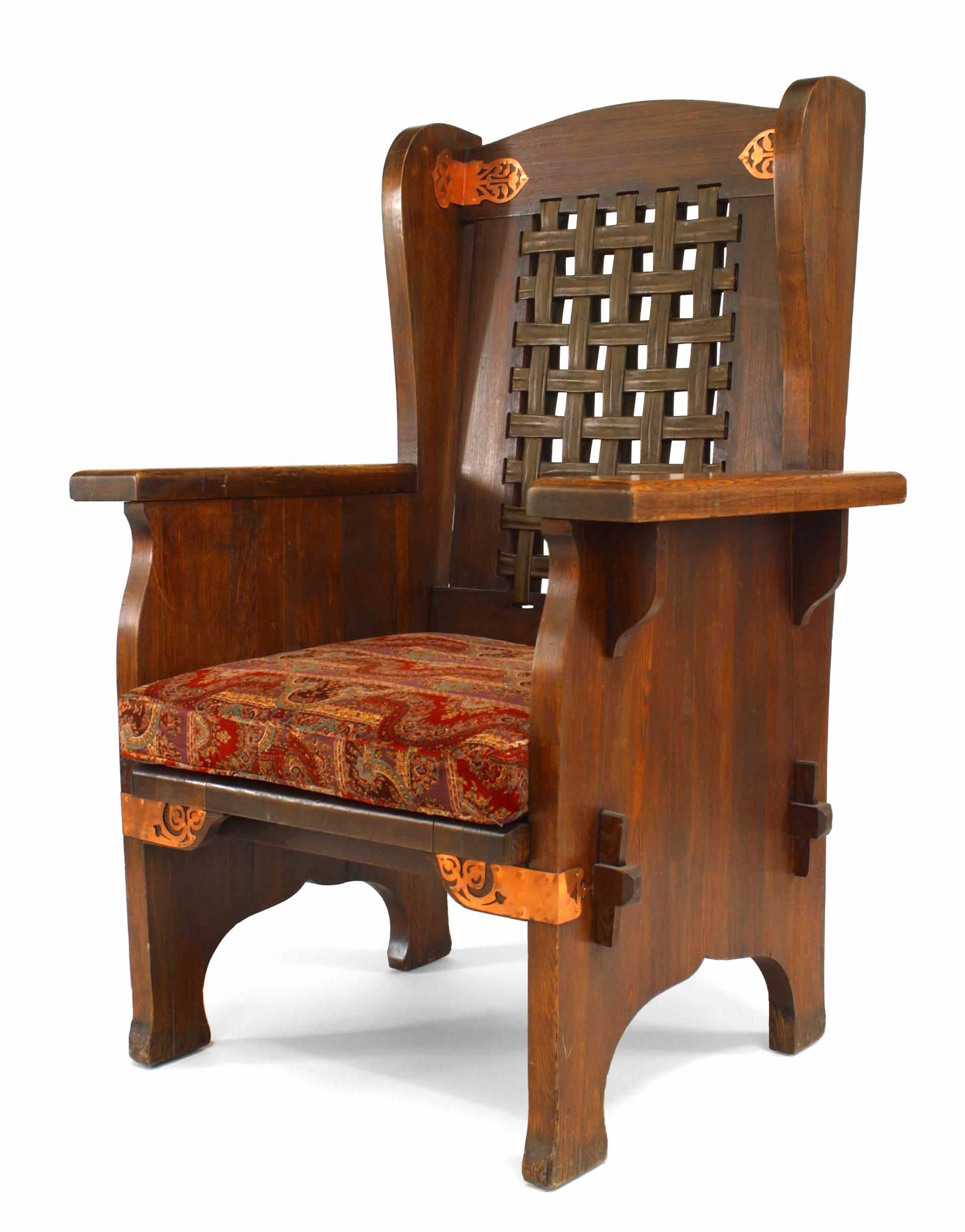 American Mission stained oak wing chair with decorative copper trim and leather mesh back with paisley seat cushion (Dexter Furniture Co., Black River).
   
