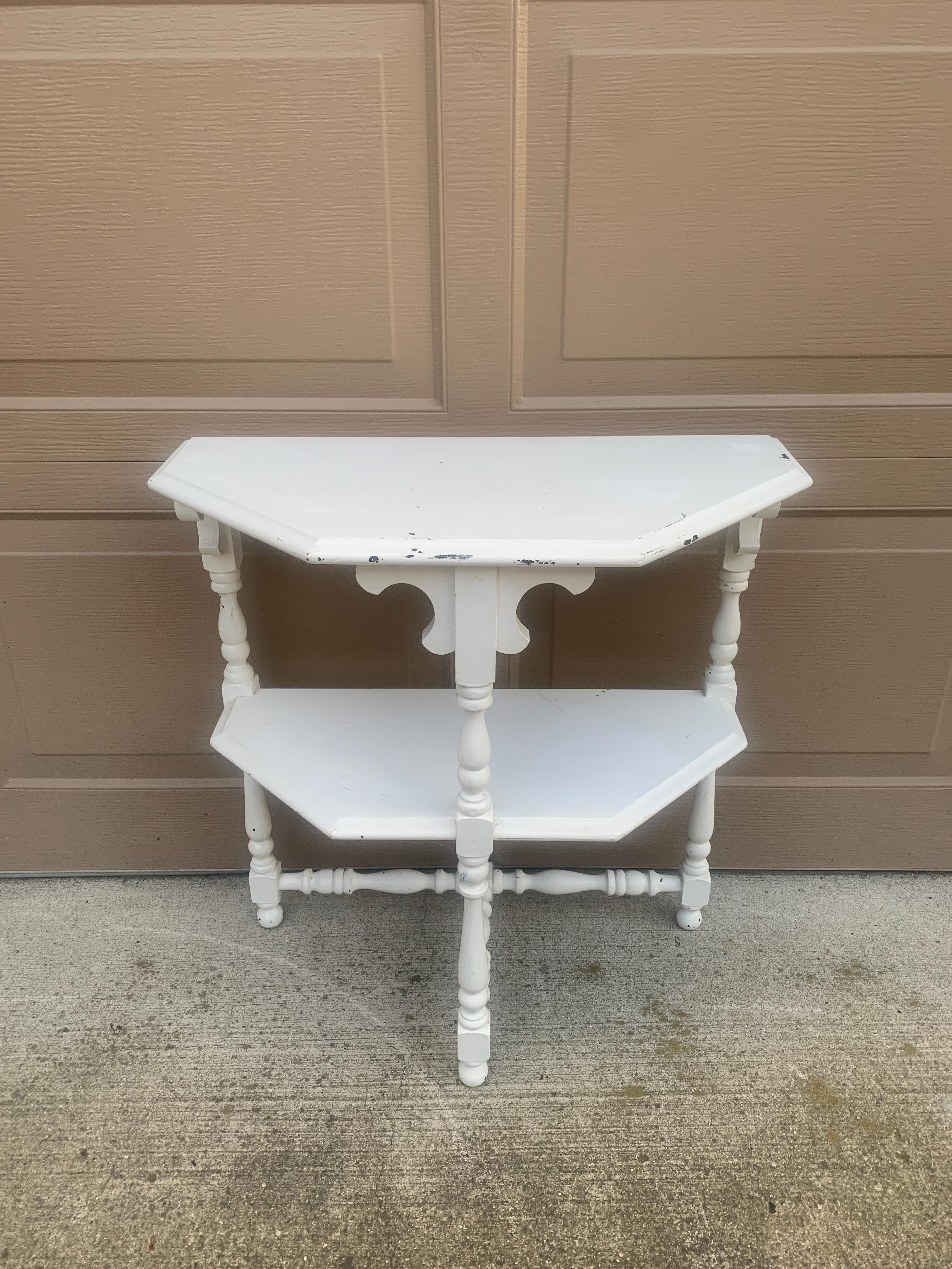 A gorgeous Victorian white painted walnut side table with a lower shelf and carved details

USA, Circa late 19th century

Measures: 24
