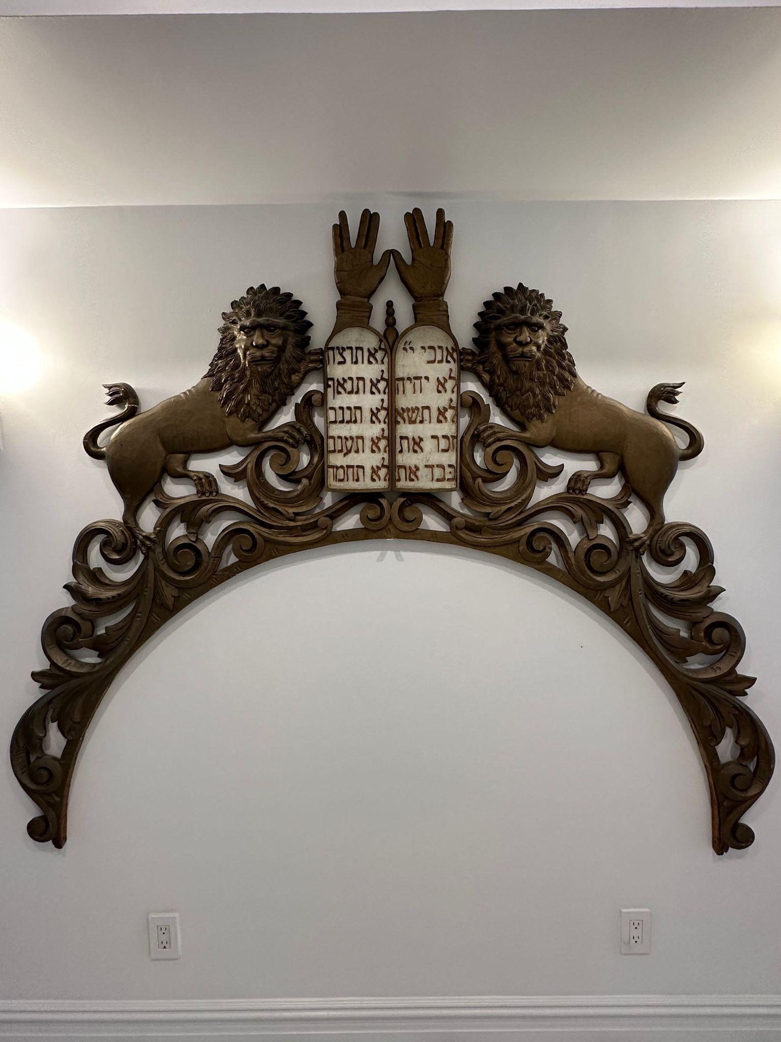 Monumental American folk art Torah Arc decoration from a synagogue. This carved wooden torah arc was made by German-Jews immigrants to the United States who were experts in this craftsmanship. These artisans contributed among others to the formation