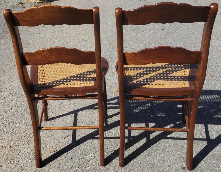 Late 19th Century Americana Cane Seat and Ladder Back Chairs, a Pair at