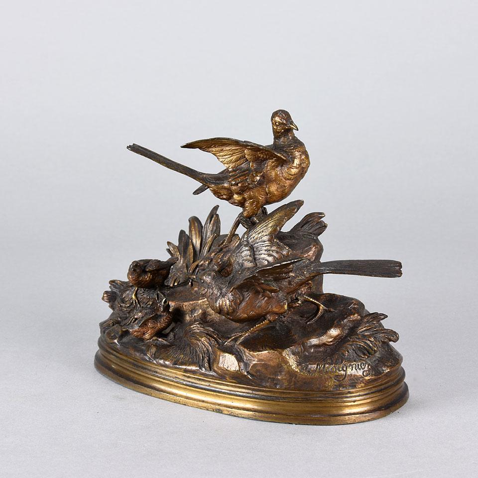 A very fine late century French 19th Animalier bronze group of a male and female bird standing on top of a naturalistic rocky outcrop with their young nestled in the undergrowth. The bronze with golden multi-hued patina and extremely fine hand