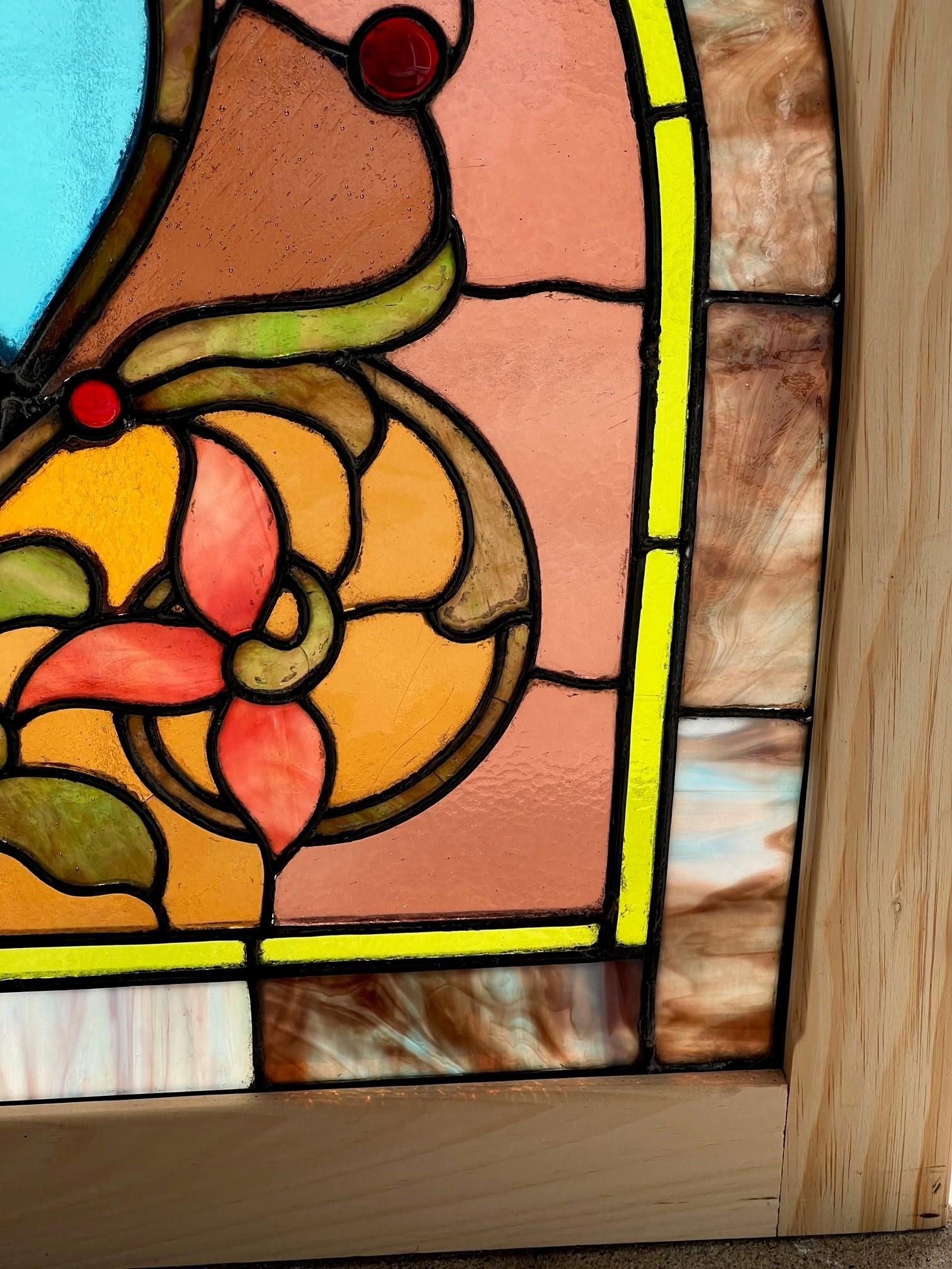 American Late 19th Century Antique Arched Stained Glass Window in a New Wood Frame For Sale
