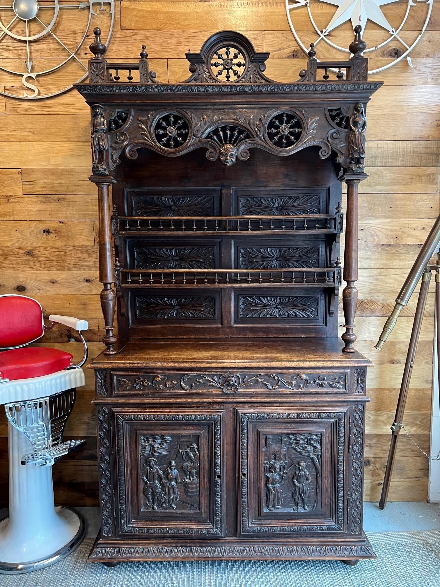 Absolutely Amazing Antique Brittany style French two door, single drawer carved cabinet with an upper plate gallery. French Breton design also known as Brittany style originated in the late 19th century France in a region to the west of Normandy,