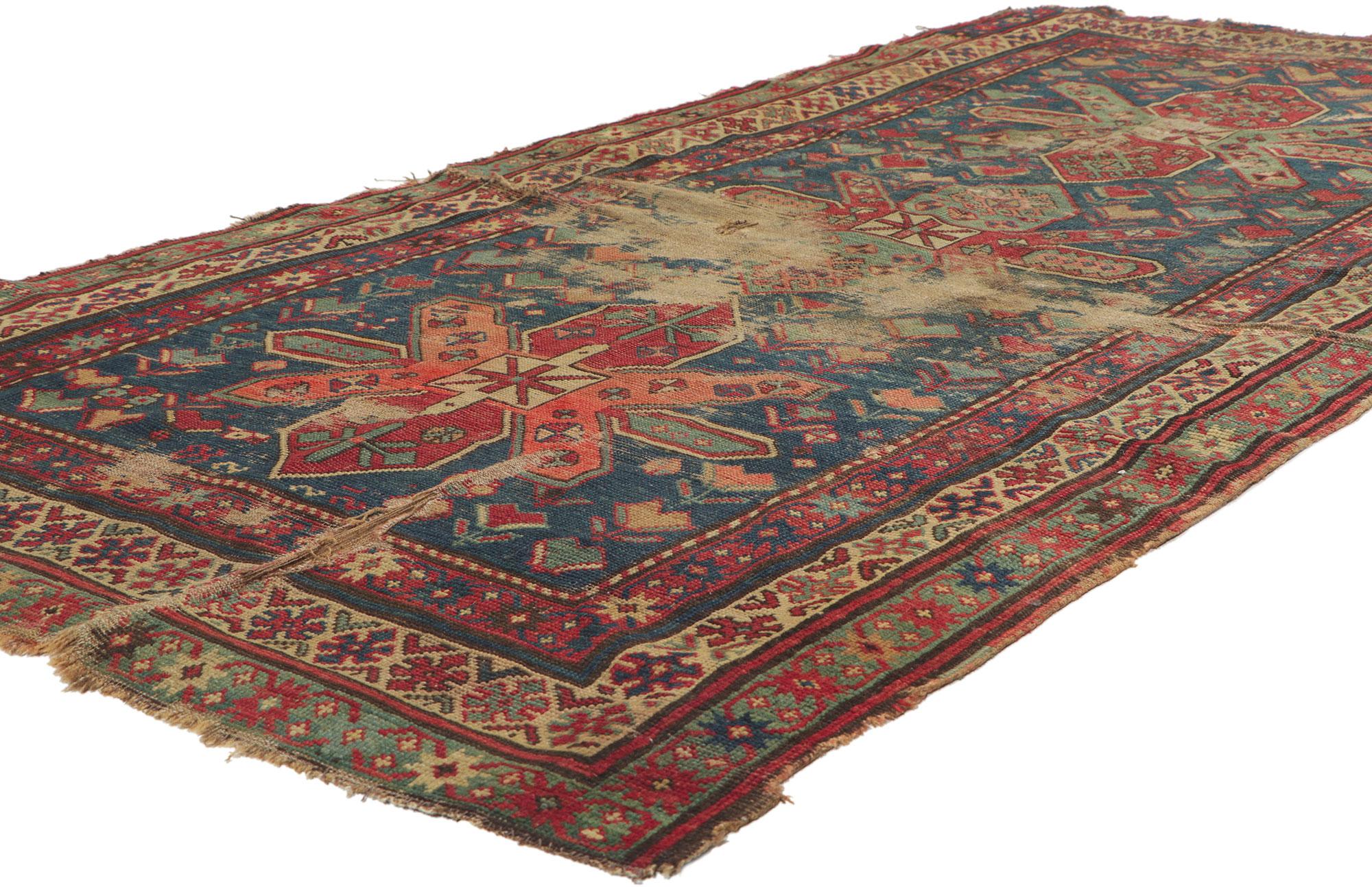 78312 antique caucasian kazak runner, 03'10 x 07'10.
Full of tiny details and nomadic charm, this hand knotted wool distressed antique caucasian kazak rug is a captivating vision of woven beauty. The eye-catching tribal design and earthy colorway