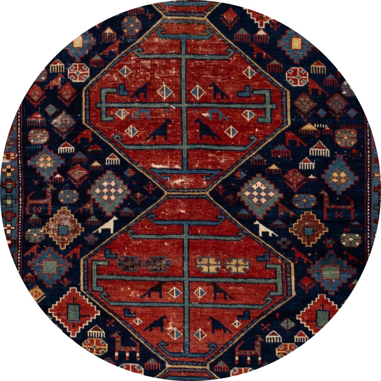 Antique beautiful Scatter Caucasian rug, hand knotted wool with a navy blue field, red and multi-color accents in all-over multi medallion design.
This rug measures 3'9