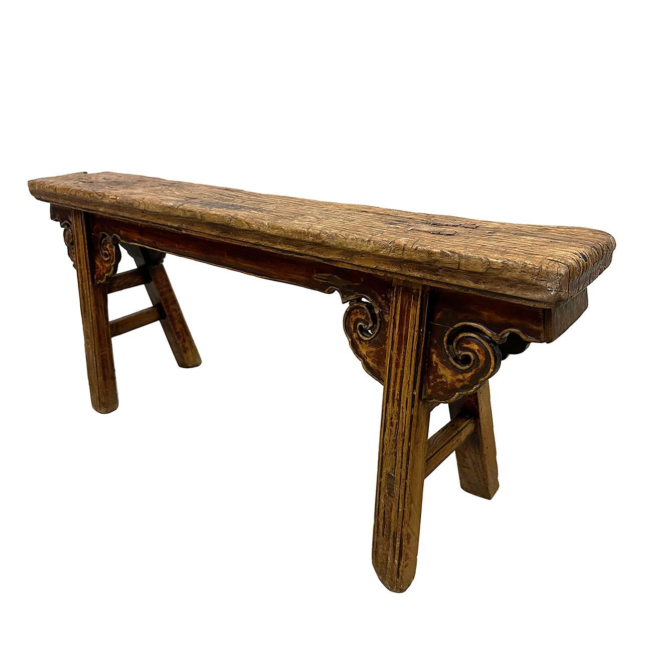 This Chinese antique country long bench that you can use it as a coffee table. This bench was a classic design and elegant with some simple carving and solid construction. Smooth to touch. A lot of patina. It was used everywhere in ancient China,