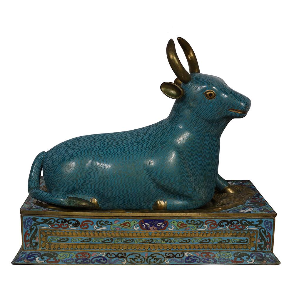 This magnificent antique Chinese Cloisonne bull statue is made from gold plated bronze/copper and shows very detailed hand craft works of Cloisonne art - a lot of Chinese traditional folks art like Buddhas flower design around the base. There are a