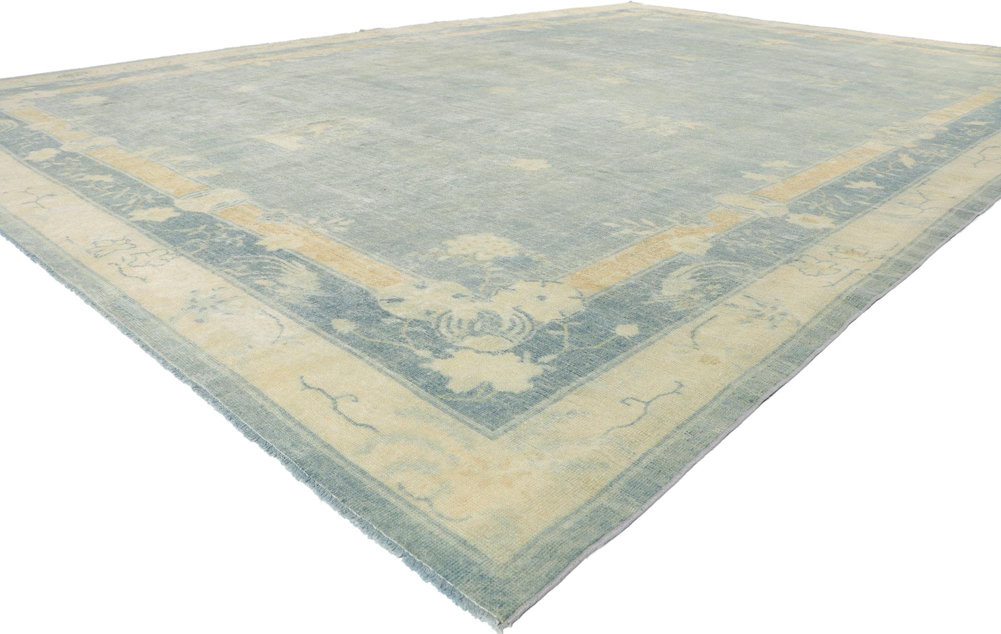 53820 Antique Chinese Peking Rug, 10'05 x 14'09. 
Chinoiserie chic meets quiet sophistication in this hand knotted wool distressed antique Chinese Peking rug. Let yourself be whisked away on an enchanting journey, as you step onto this mesmerizing