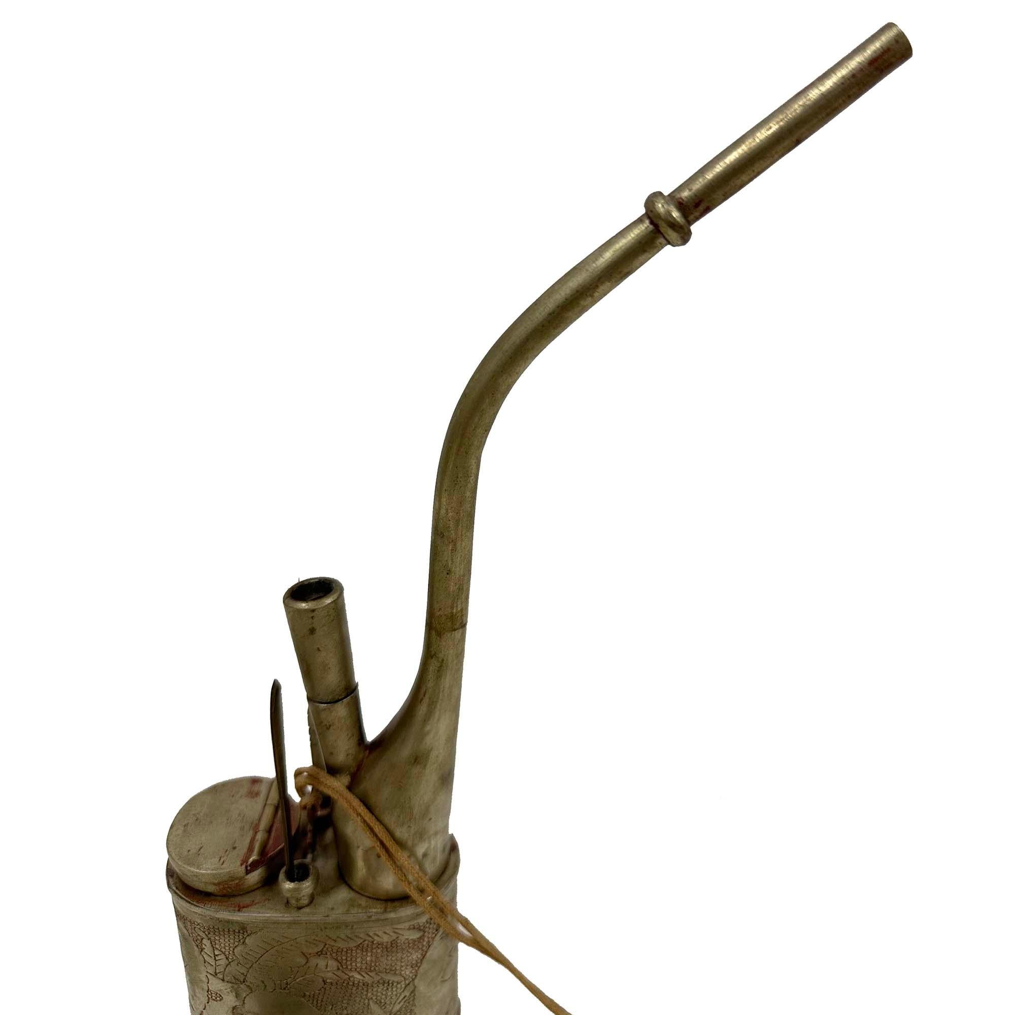 This antique Chinese water pipe, from the late 19th century and originating from Canton, China. This water pipe designed for smoking tobacco, often mistaken for an opium pipe due to similar historical contexts and settings where both were used.
