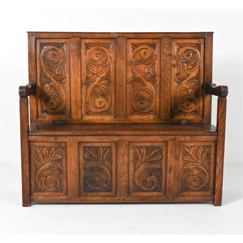 Beautiful carved oak bench with hidden storage under the seat.

c. late 19th or early 20th century.

Unmarked.
