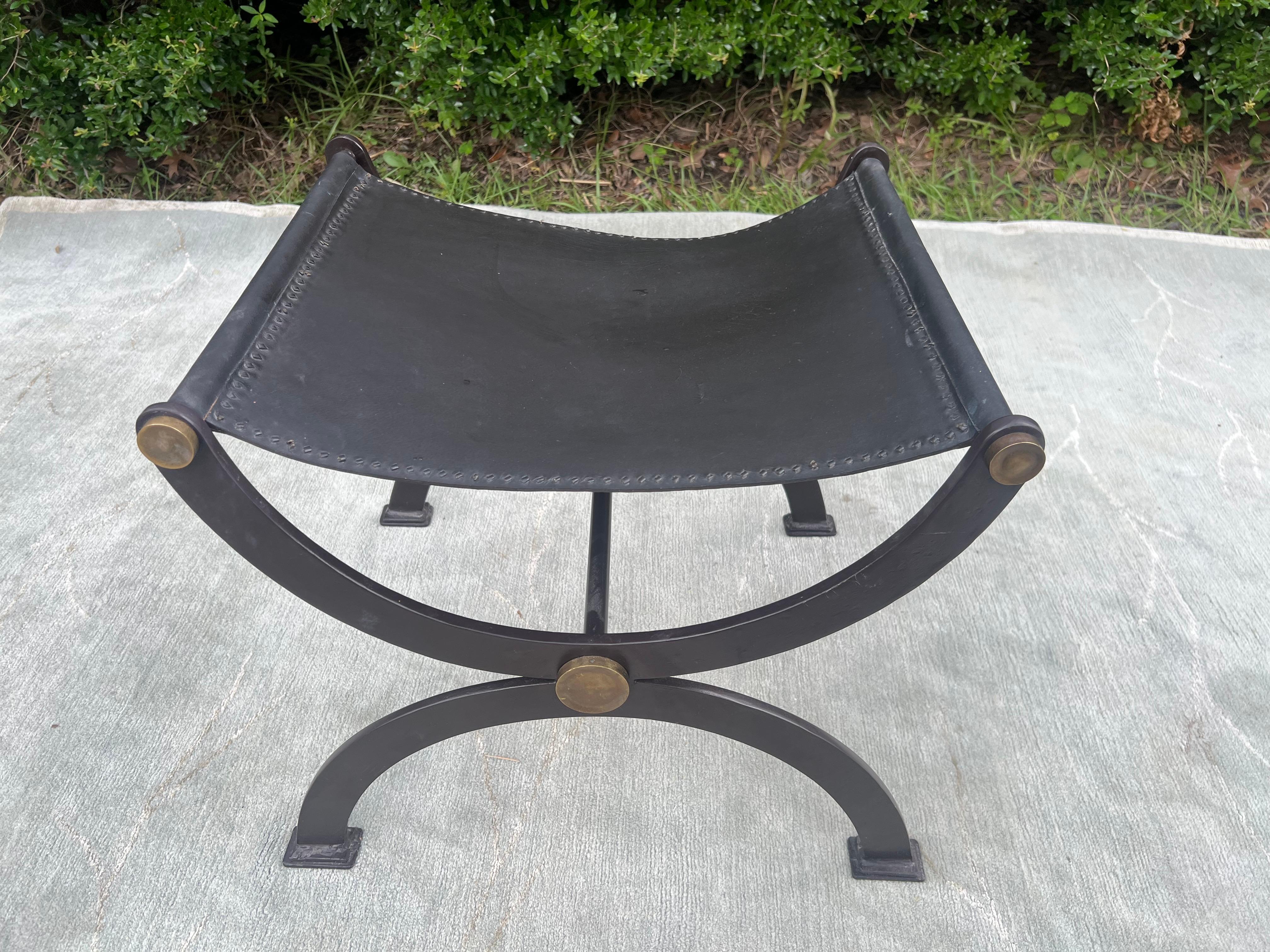 Leather and Iron Curule-Form Stools
Late 19th Century/ early 20th century  Antique French Empire Wrought Iron, Brass and Leather Stool

Curule Savonarola Italian Black Leather low stool/bench which is defined by their signature semi-circular frames.