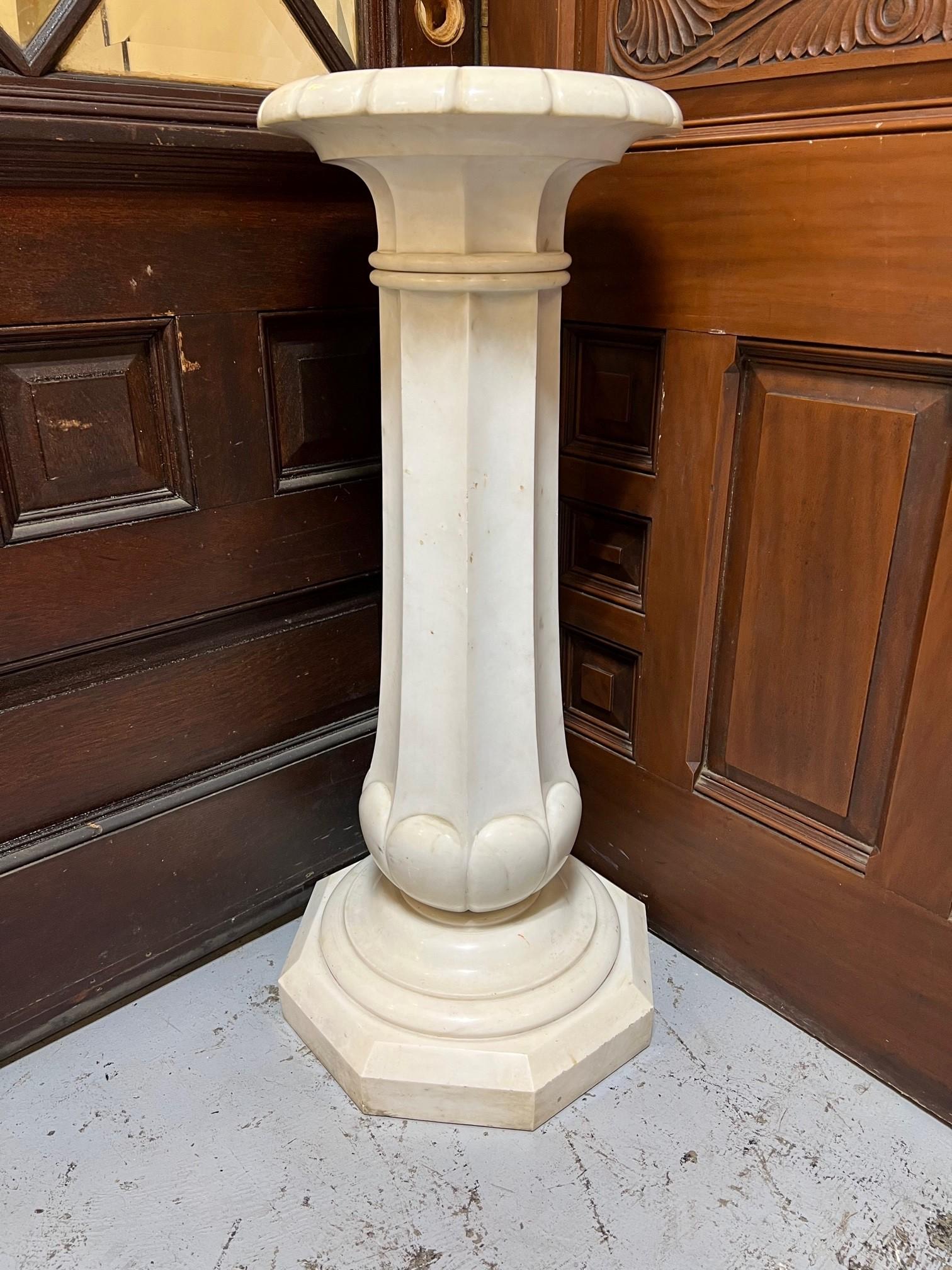 A beautiful Italian late 19th century Carrara marble pedestal column. The pedestal is raised by an octagon base below a circular band which supports the column. Its a great looking pedestal in very good condition which supported a beautiful marble