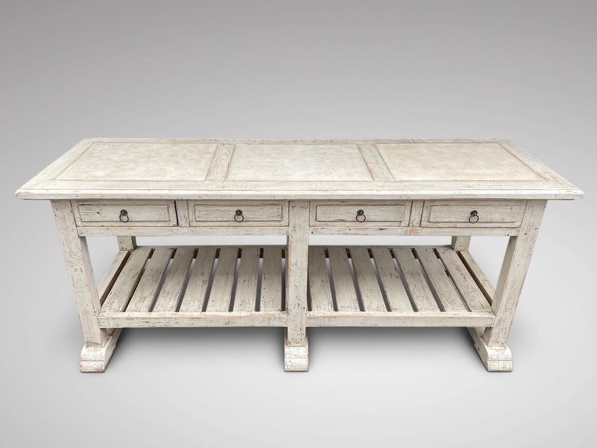 We are delighted to offer for sale this late 19th century white painted kitchen island work table. Three square inset white marble tops to the top shelf above four drawers and full length storage open shelve, standing on 6 square legs and