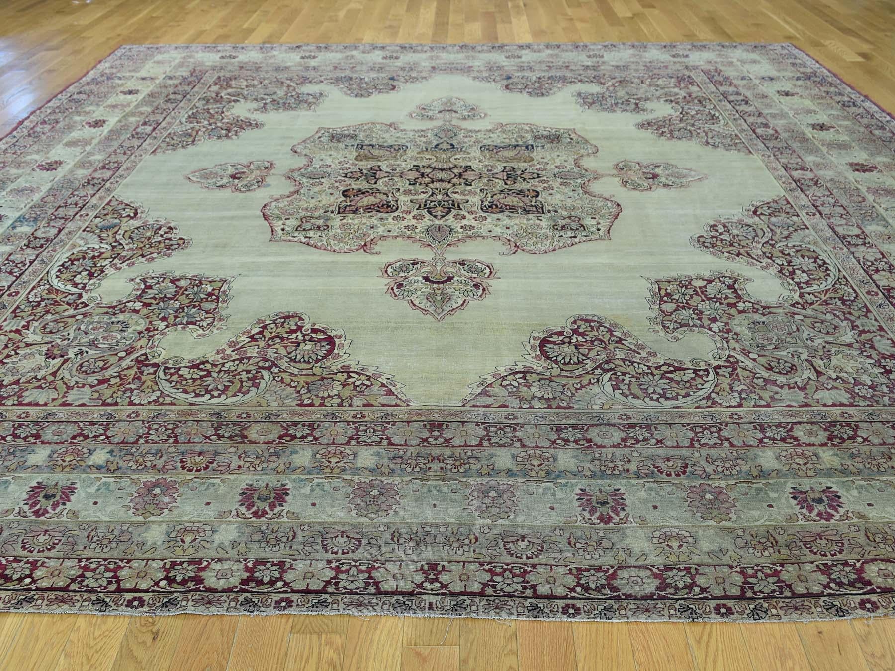 This is a genuine hand knotted oriental rug. It is not hand tufted or machine made rug. Our entire inventory is made of either hand knotted or handwoven rugs.

Bring life to your home with this lovely antique carpet. This handcrafted Lavar Kerman