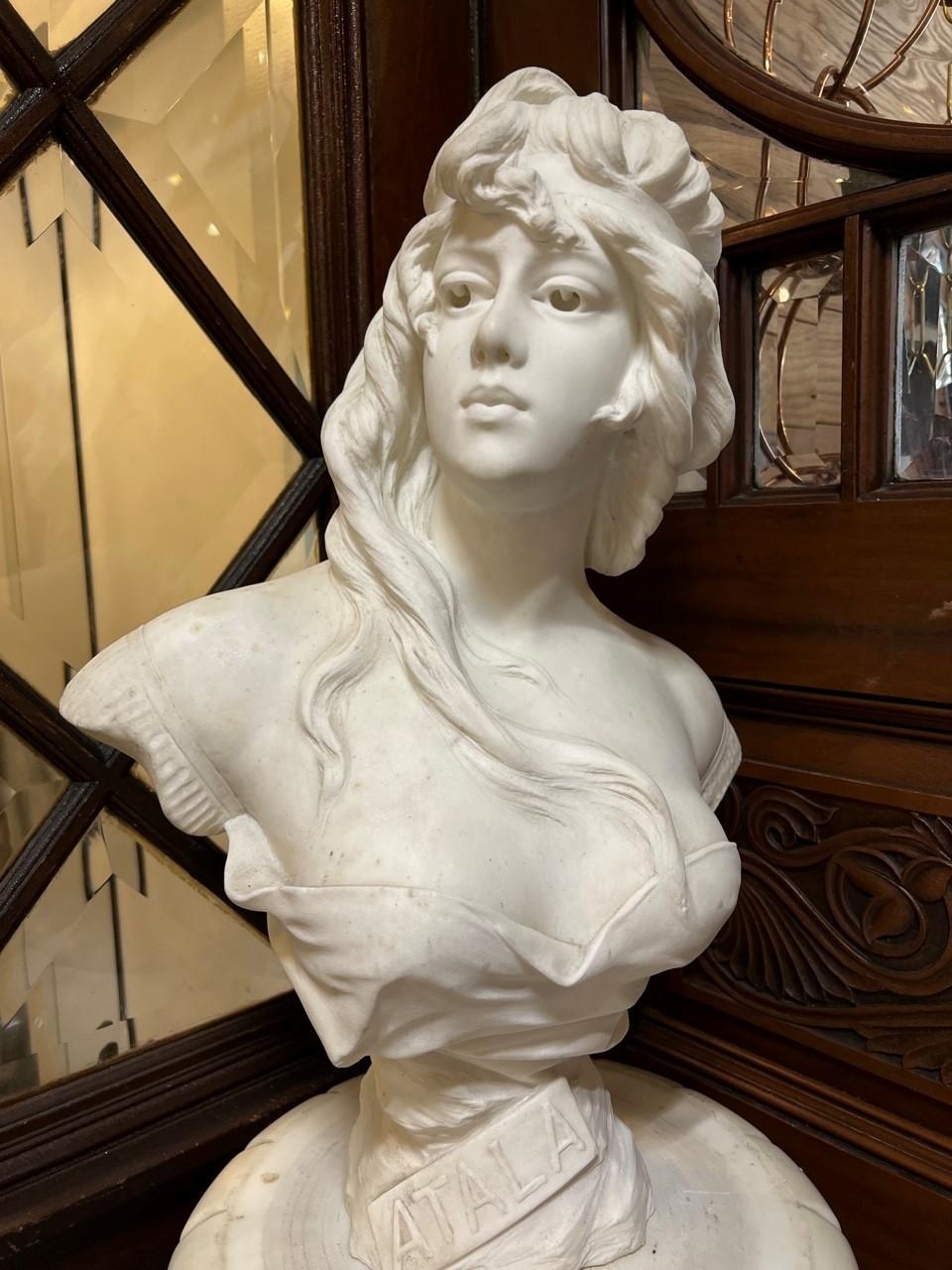 A beautiful marble bust of a young woman Atala, handed carved of white Carrara marble in the 1890s signed A. Piazza, Carrara. Carrara is a city in Italy famous around the would for its white and blue-gray marble quarries used by Michelangelo and