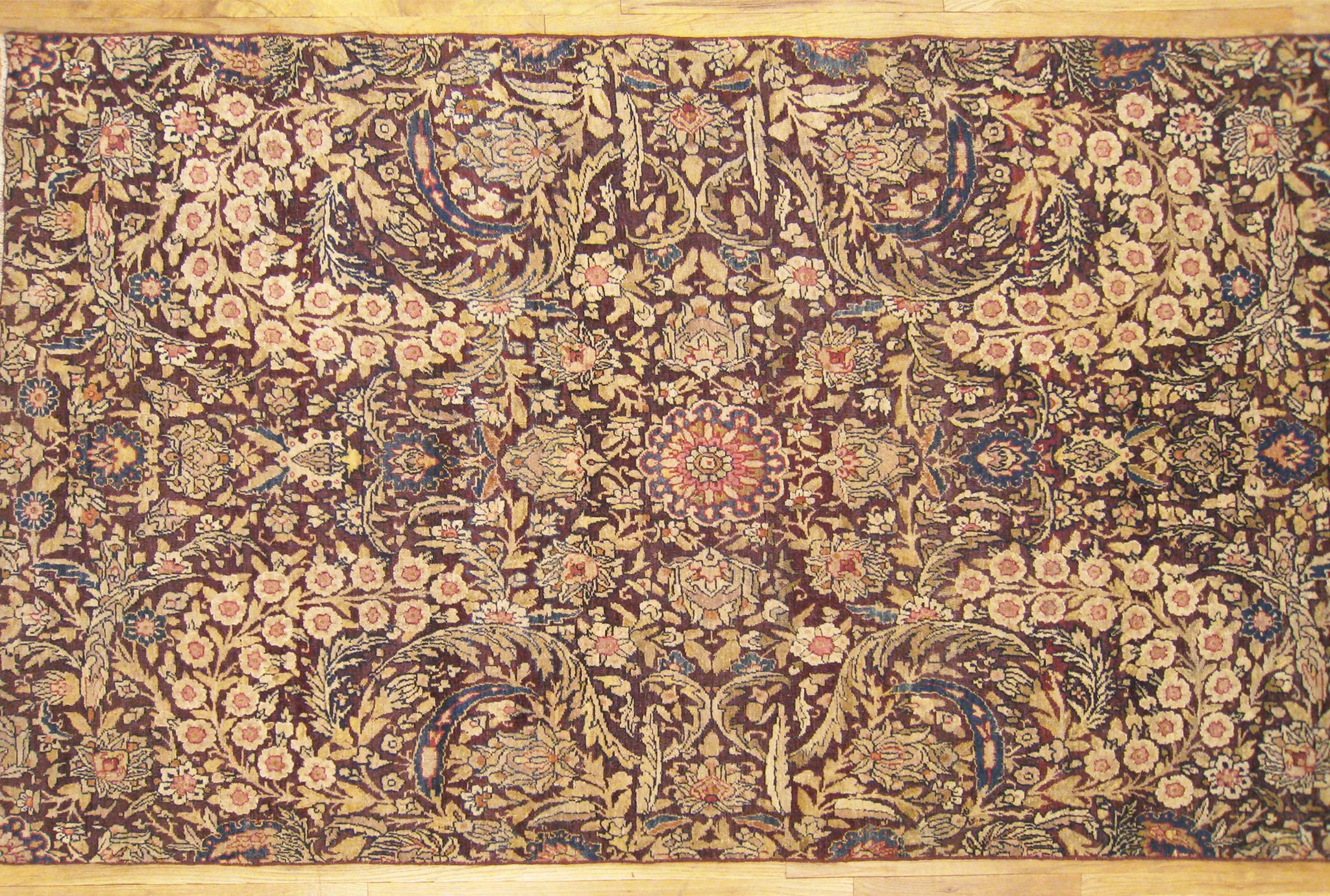 Antique Borderless Persian Lavar Oriental Rug, in Gallery size, Repeating Floral In Good Condition For Sale In New York, NY