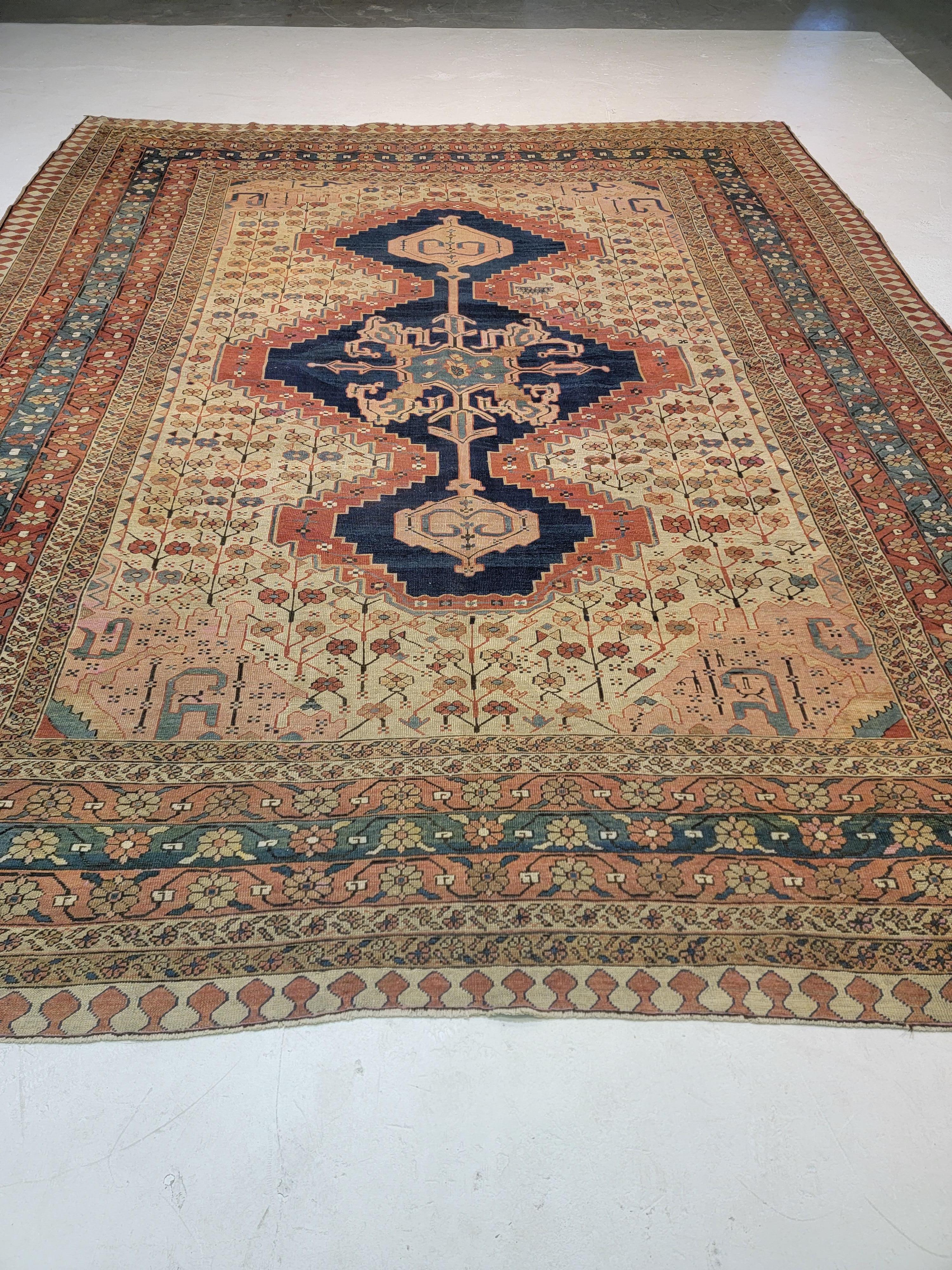 Absolutely rare original in all aspects and details.
130 year Persian Serapi Geo Floral Rug with an Ivory background and 3 Medallions. 
Age apparent patina, well distributed different color percentages of the whole, no dominant color.

Size: 11'6
