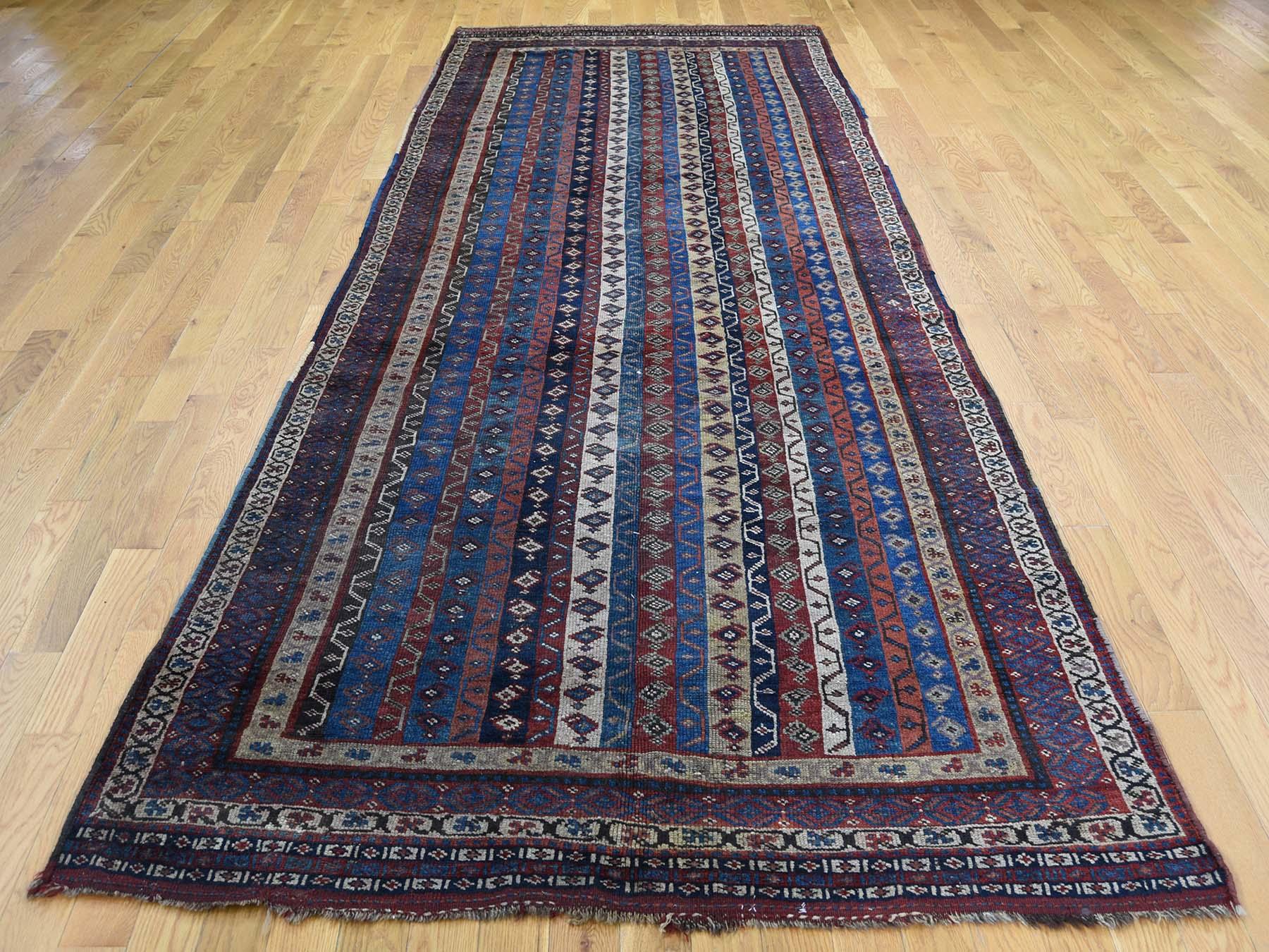 This is a genuine hand knotted oriental rug. It is not Hand Tufted or Machine Made rug. Our entire inventory is made of either hand knotted or handwoven rugs.

Bring life to your home with this lovely hand knotted Blue Antique Lori Buft , is an