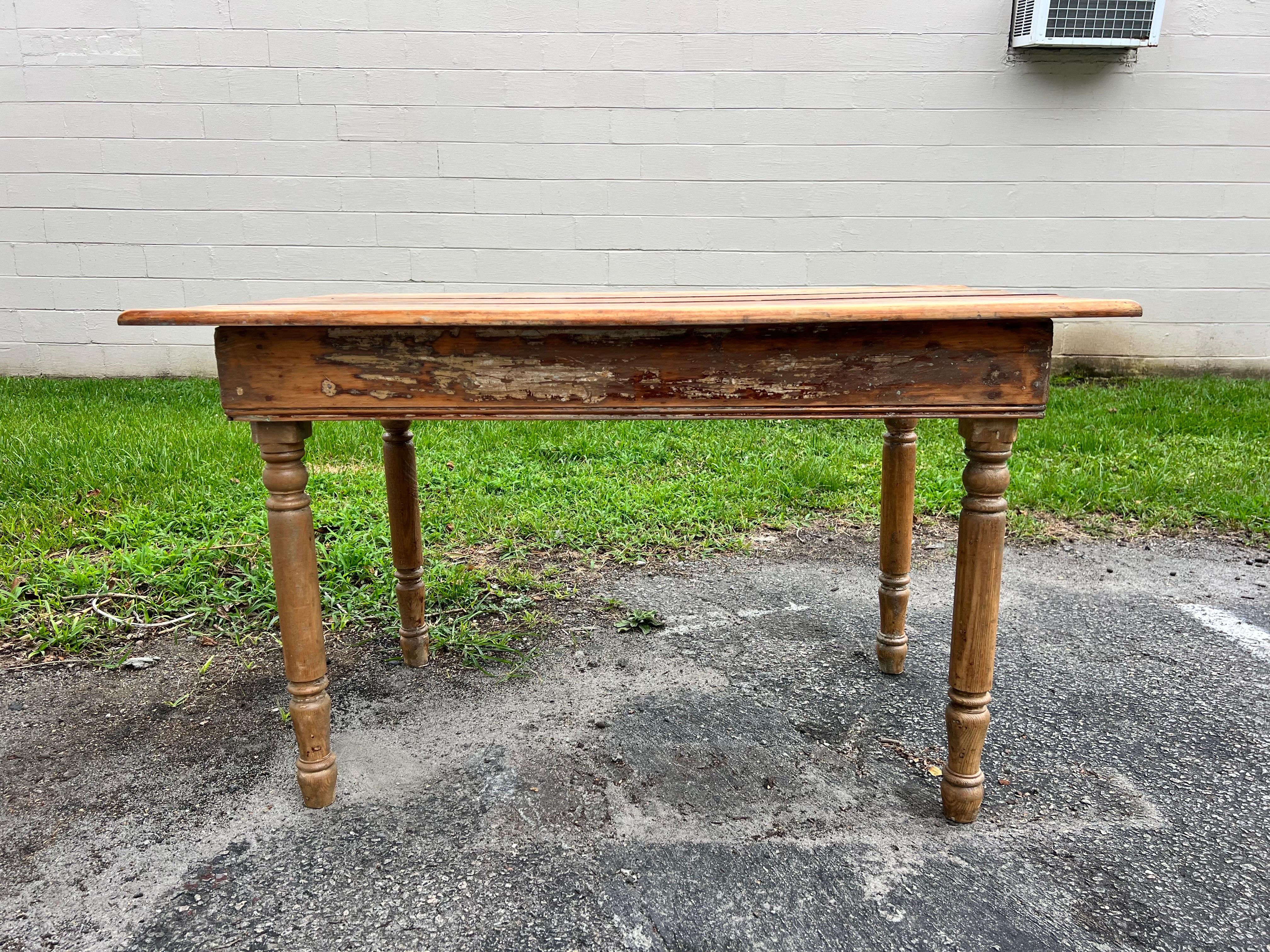Late 19th Century American 3 plank top pine farmhouse table.   With turned legs and excellent patina, this table is very well constructed.   Great kitchen table or could be used as a console table, sofa table, desk…very versatile.